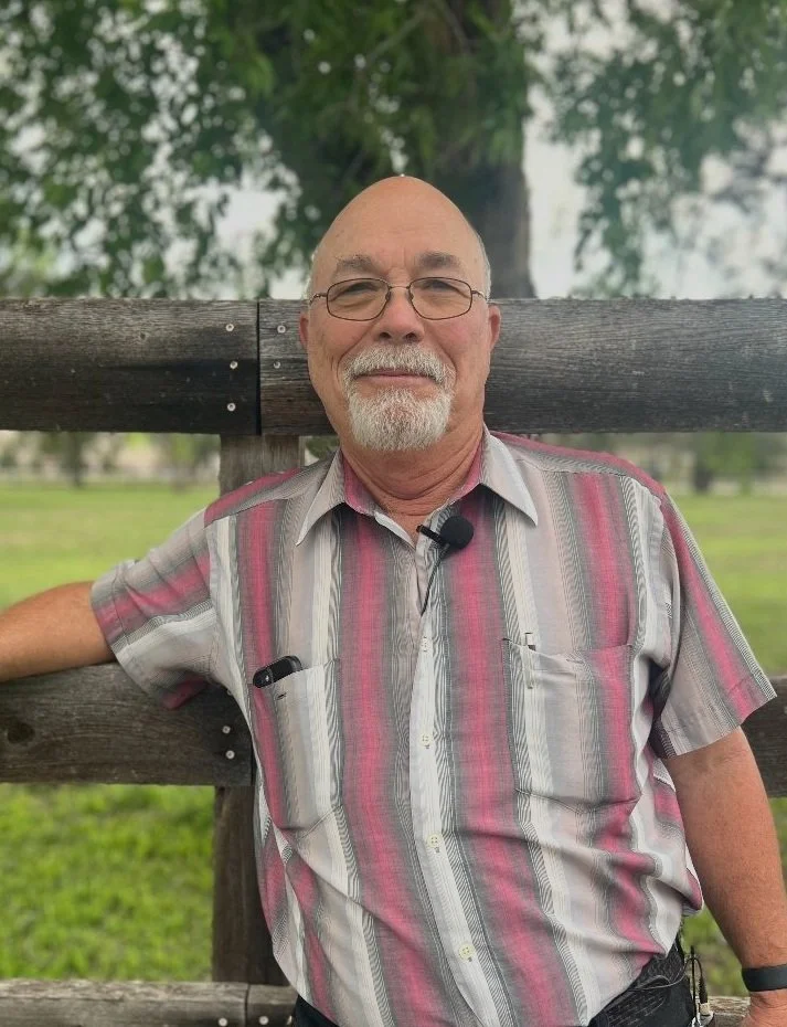 Pastor John Sparks seated outdoors