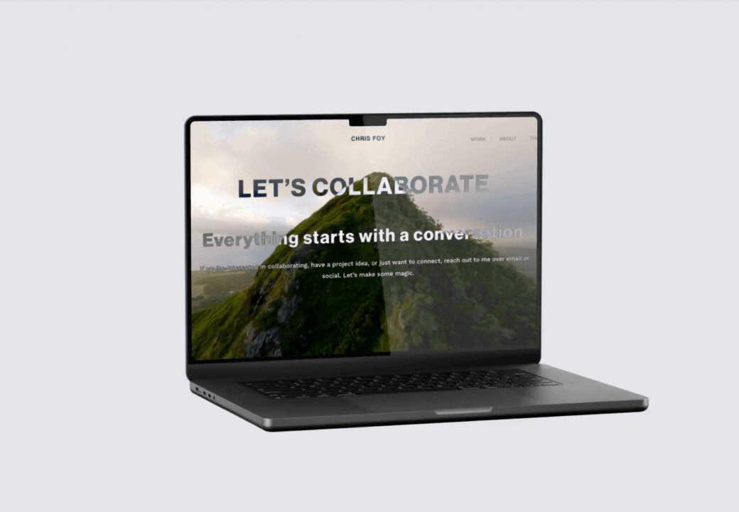 Open laptop displaying a website with a mountain background and the text 'Let's Collaborate'.