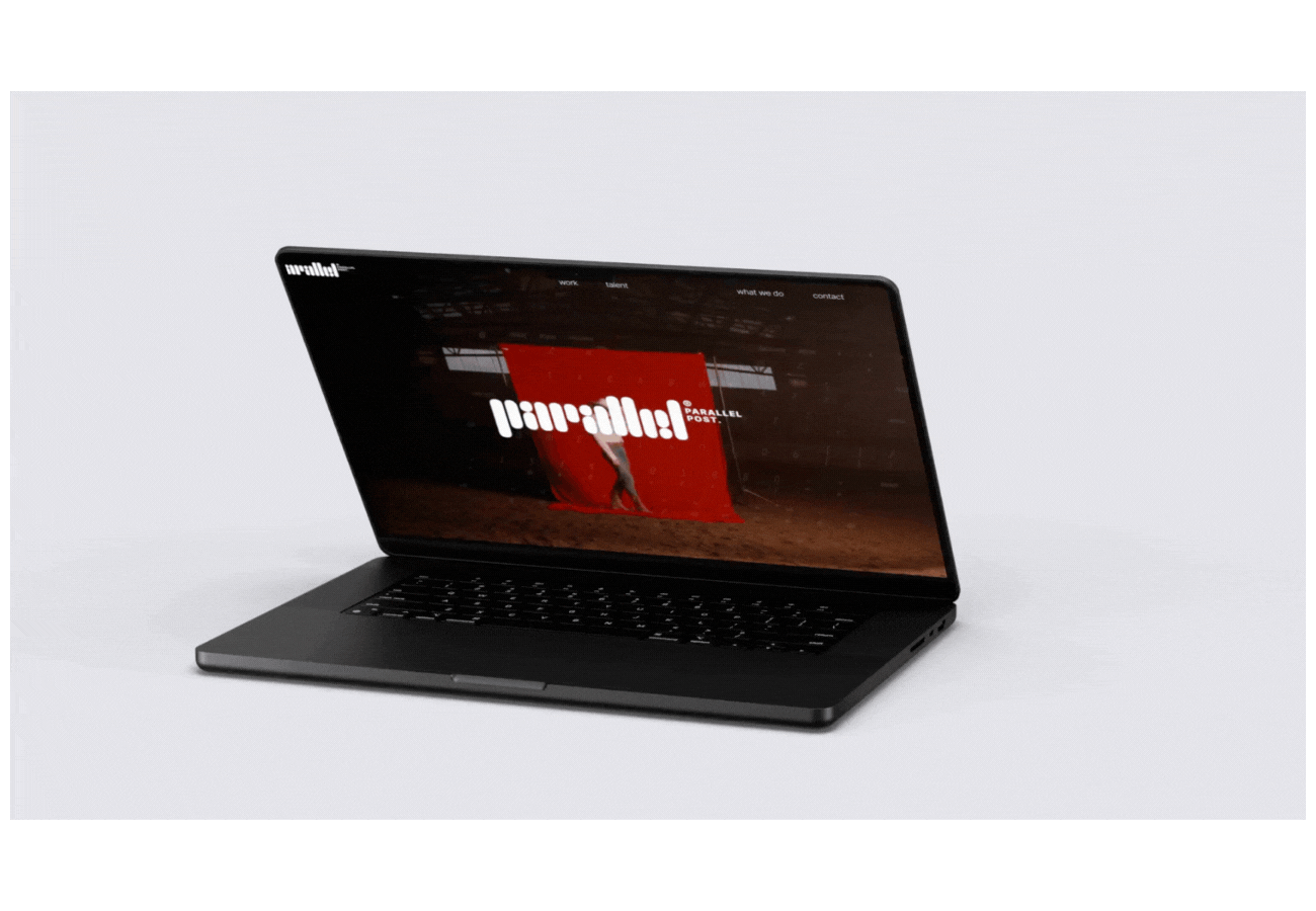 Laptop displaying a website with the logo 'Parallel Post' on the screen.