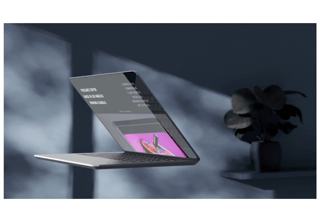 A floating laptop displaying a graphic on its screen with a potted plant in the background.