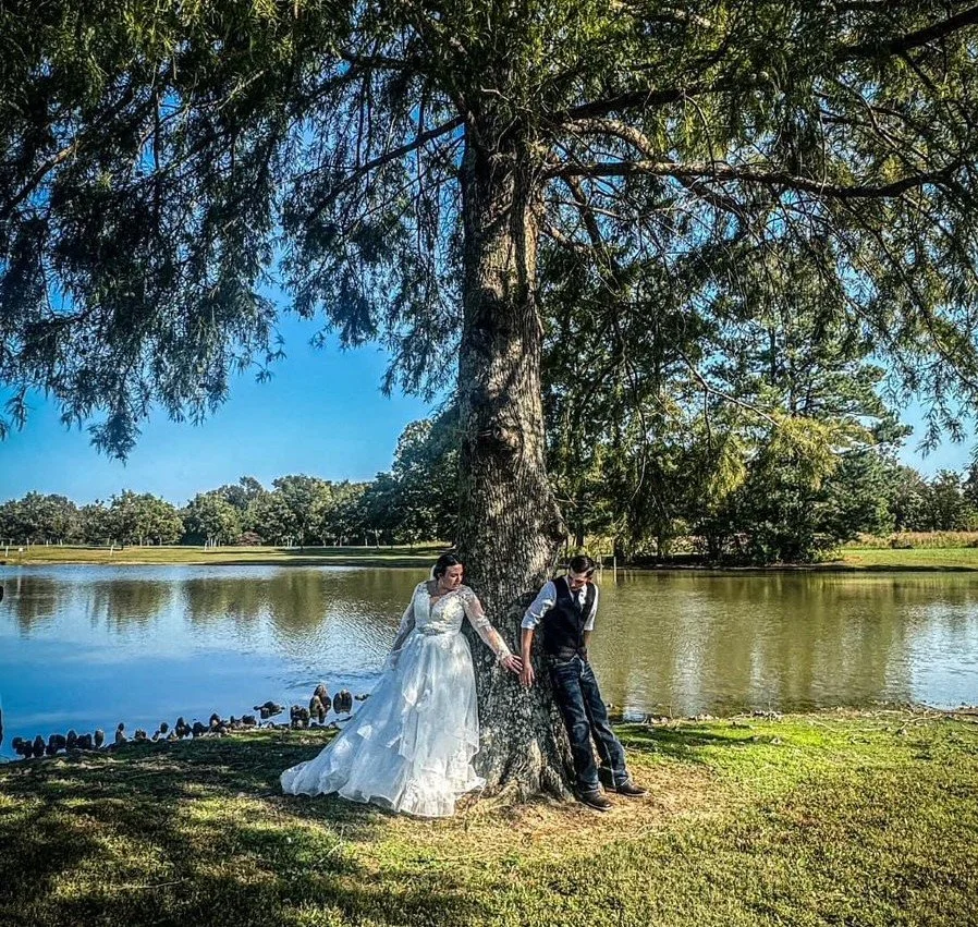 Noah and Bekah under cypress