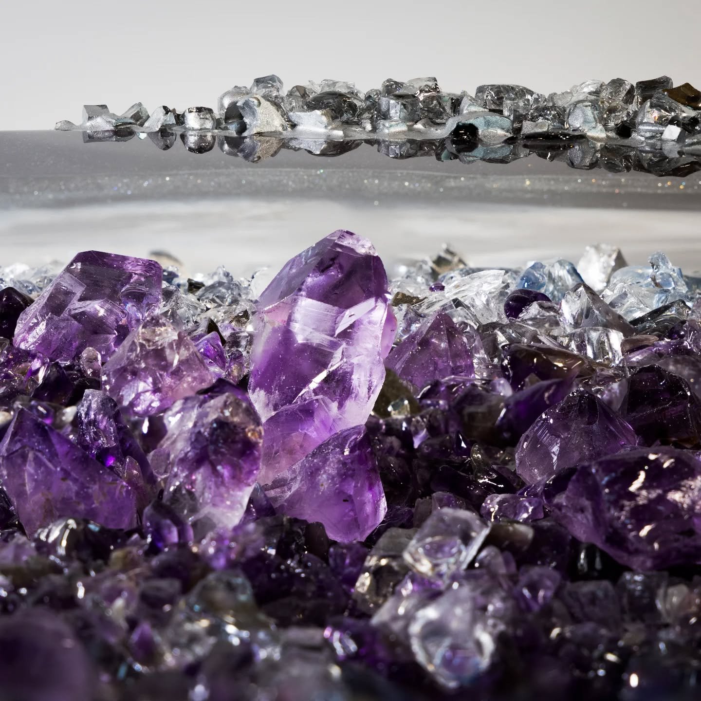 What happens when you turn light into texture?

The artwork no one else will own.
Hand-poured resin, real crushed crystal, and a layering process that takes days &mdash; all to create one immersive experience.
This piece shimmers like a geode, but it