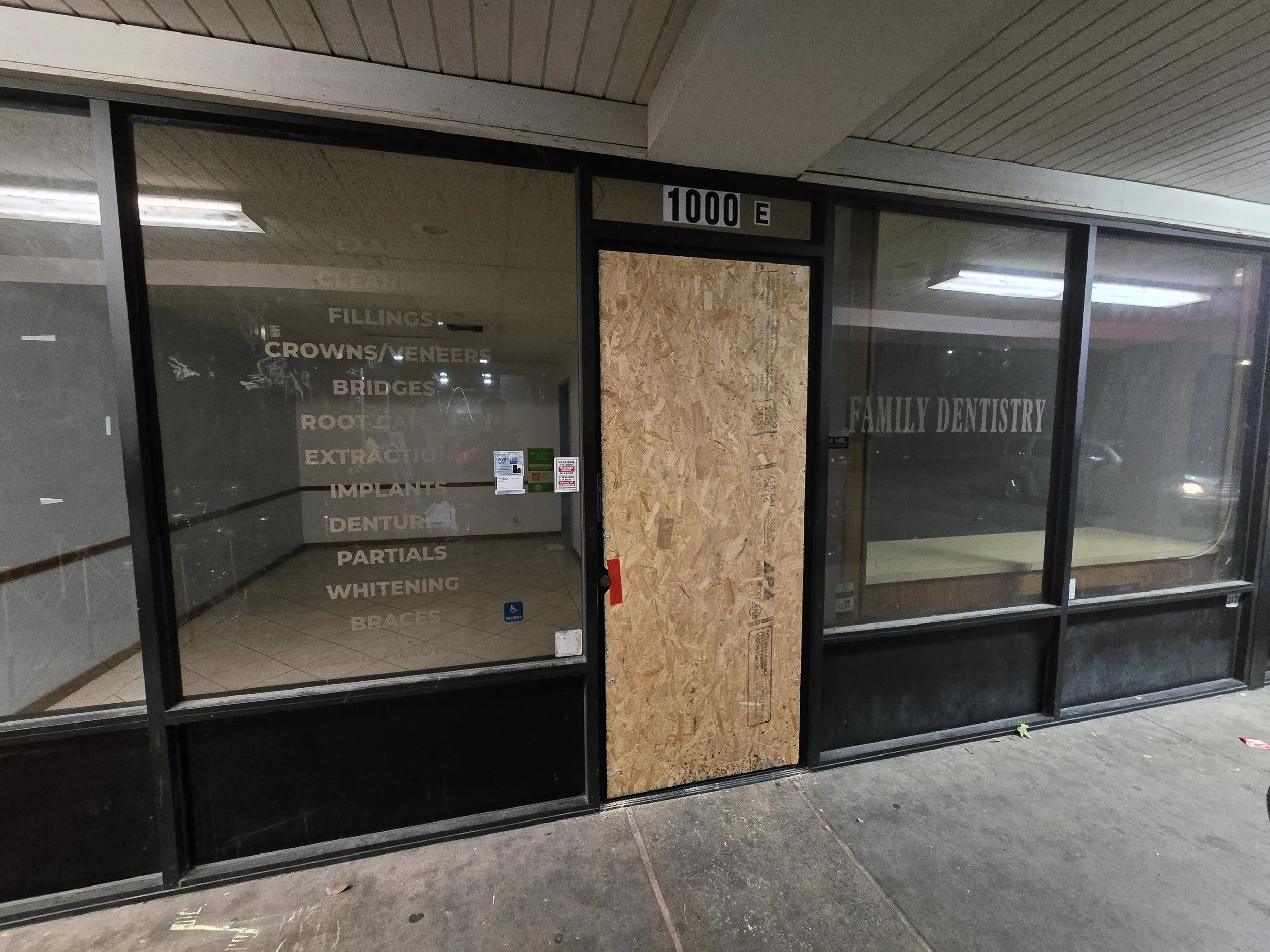 Medical office board-up in Los Angeles — plywood securing the main 
entry door. Commercial service by Boardup LA.