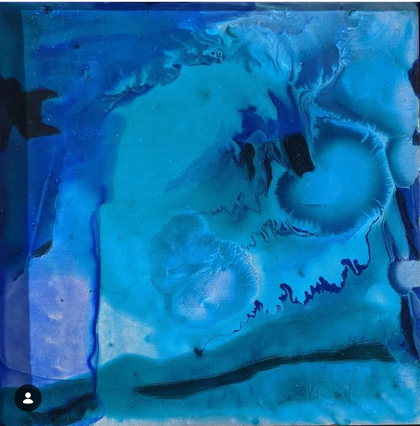 Abstract blue painting with swirling and flowing patterns, resembling a close-up of ice or water with darker blue and black accents.