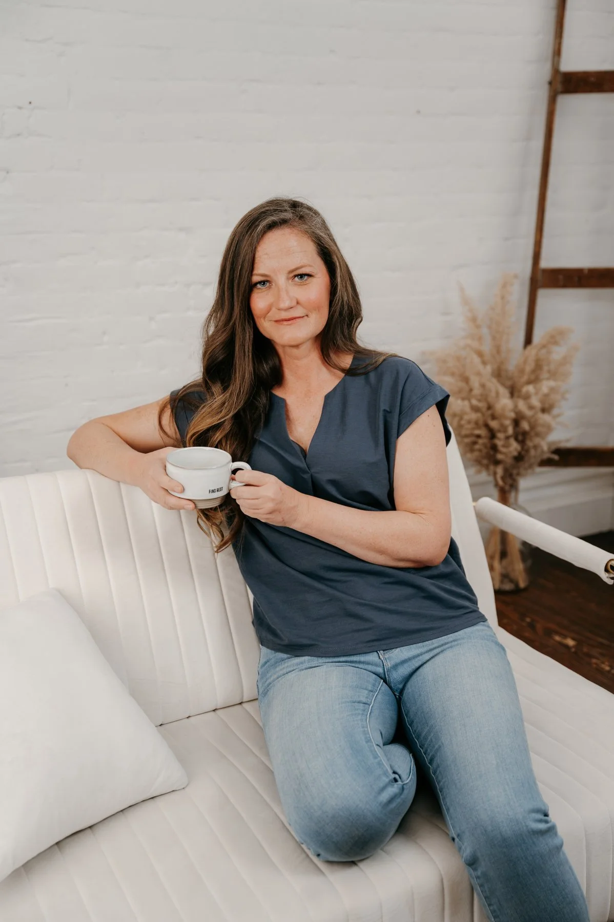 Brie Doyle, Certified Professional Coach and founder of Stellar Perspective Coaching, smiling in a welcoming environment.