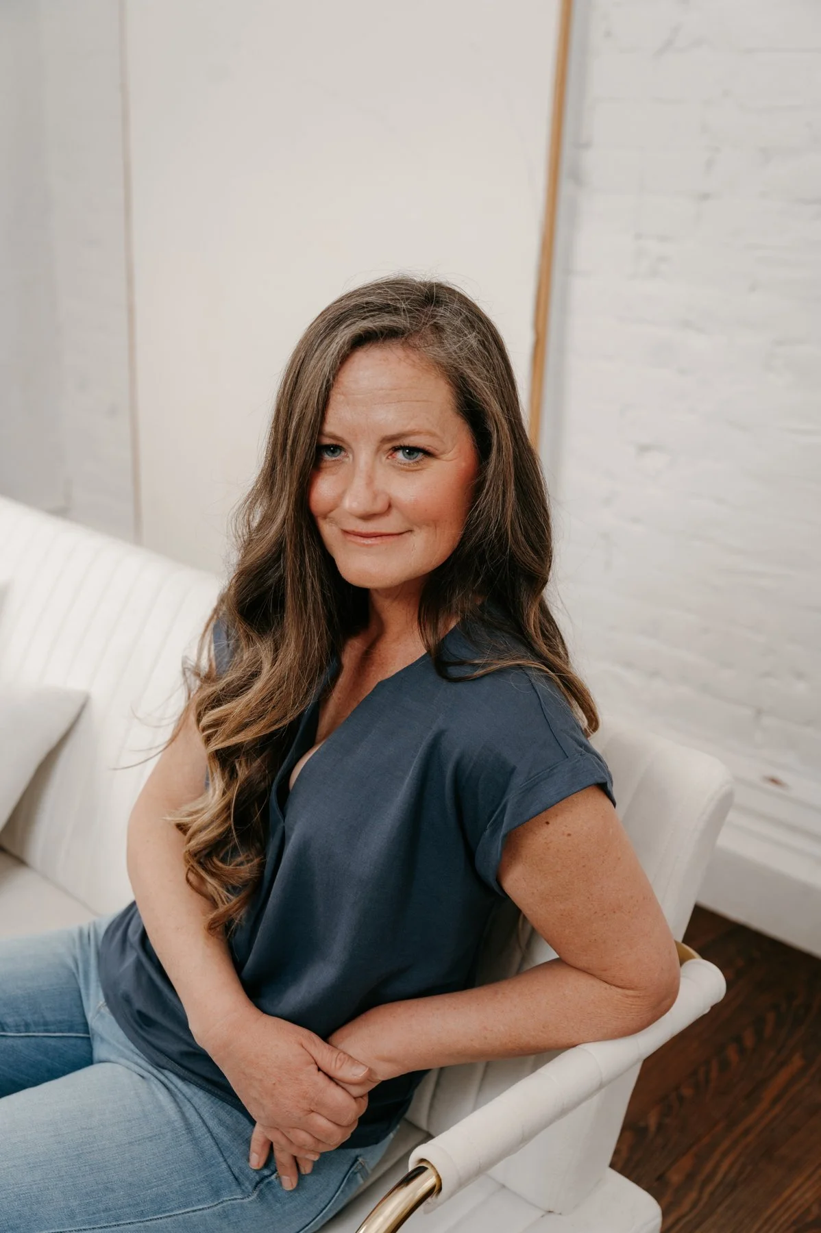 Brie Doyle, Certified Professional Coach and founder of Stellar Perspective Coaching, smiling in a welcoming environment.