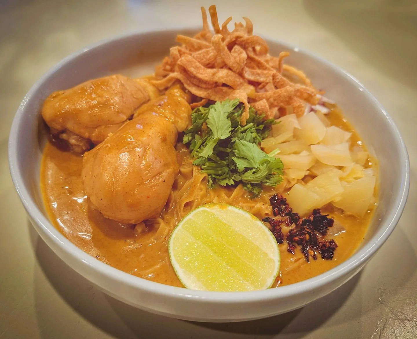 “Khao Soi is the iconic Northern Thai noodle curry. A perfect balance of rich coconut curry, tender noodles, and crunchy toppings in every bite.” #winsomefoods_thai #cookingclass #catering #privatechef #jacksonhole #thaifoods