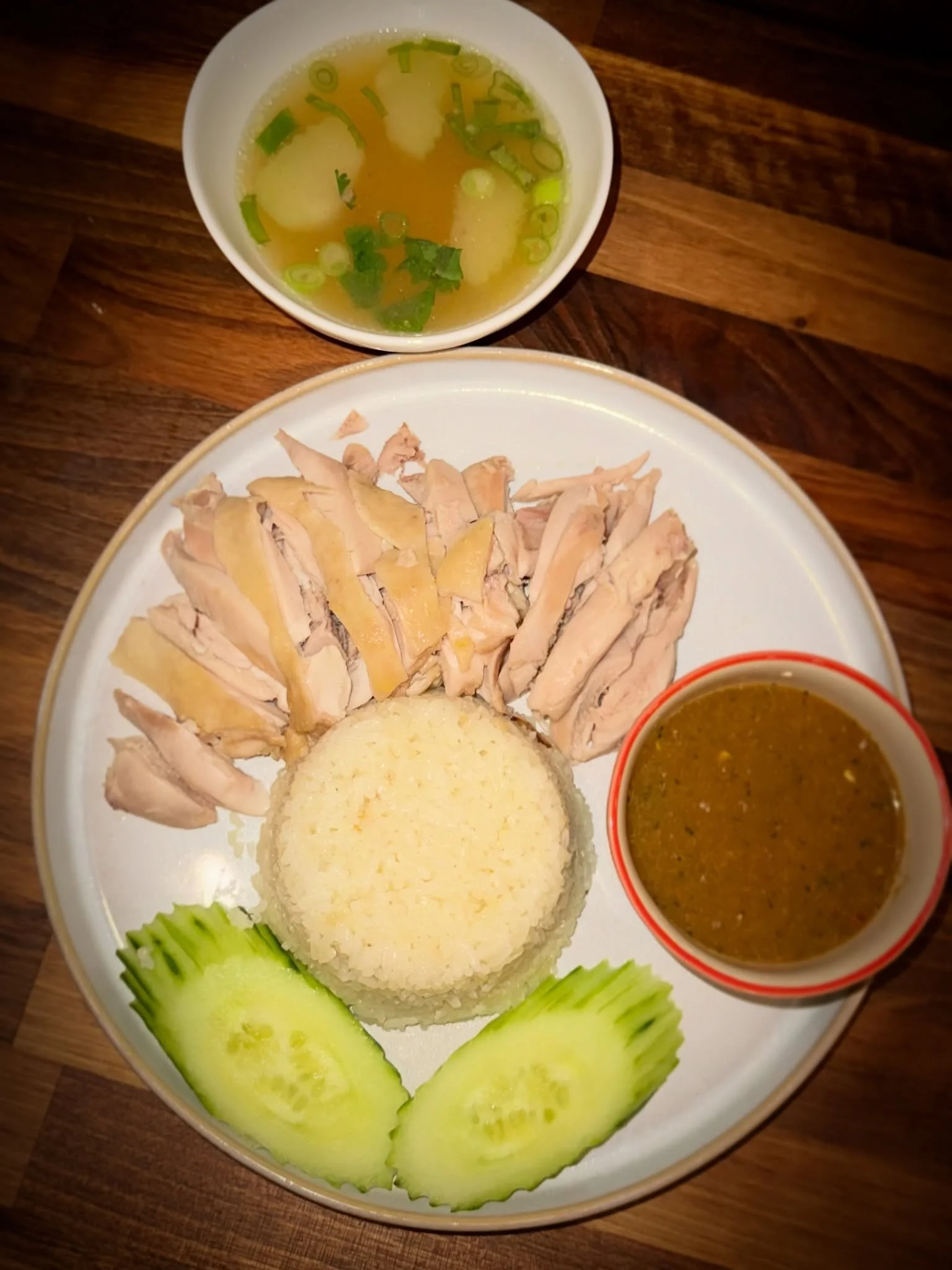 &ldquo;Khao Man Gai&rdquo; isn&rsquo;t just a chicken and rice dish&mdash;it&rsquo;s all about the sauce. A rich blend of fermented soybean paste, ginger, garlic, and chili, packed with umami, gentle heat, and a fresh zing in every bite. One of my al