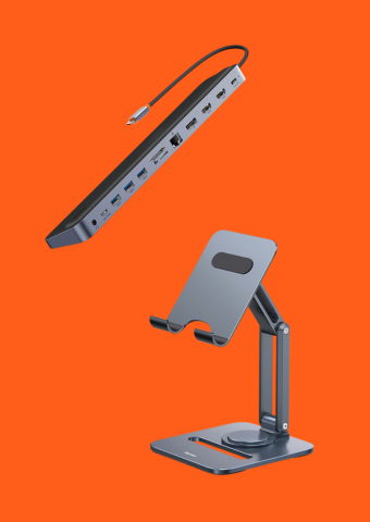 A black USB hub with multiple ports and a black power cable, and a metallic adjustable device stand on an orange background.