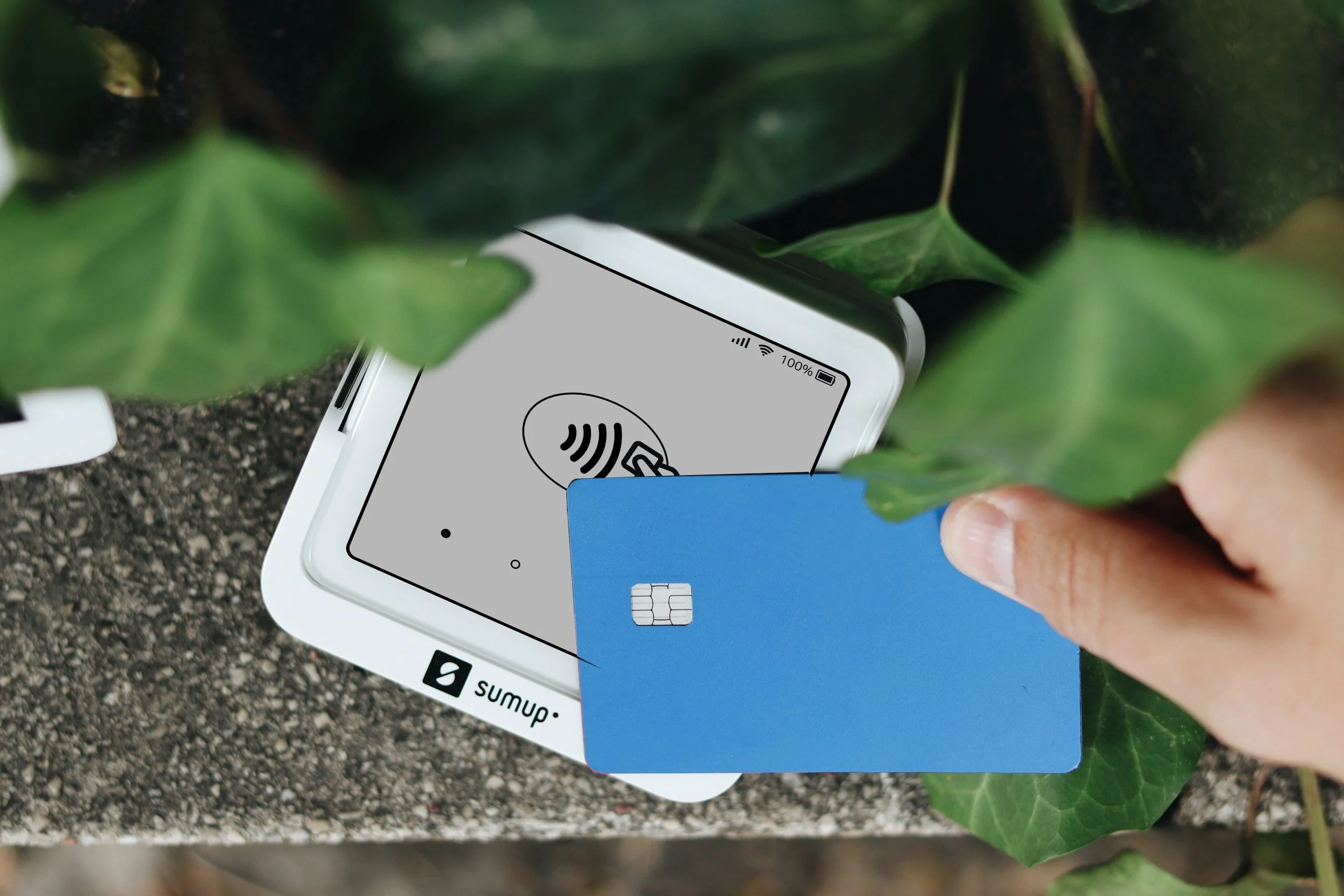Person tapping a blue credit card on a wireless payment terminal representing CNA training tuition payment at Medical Plus.