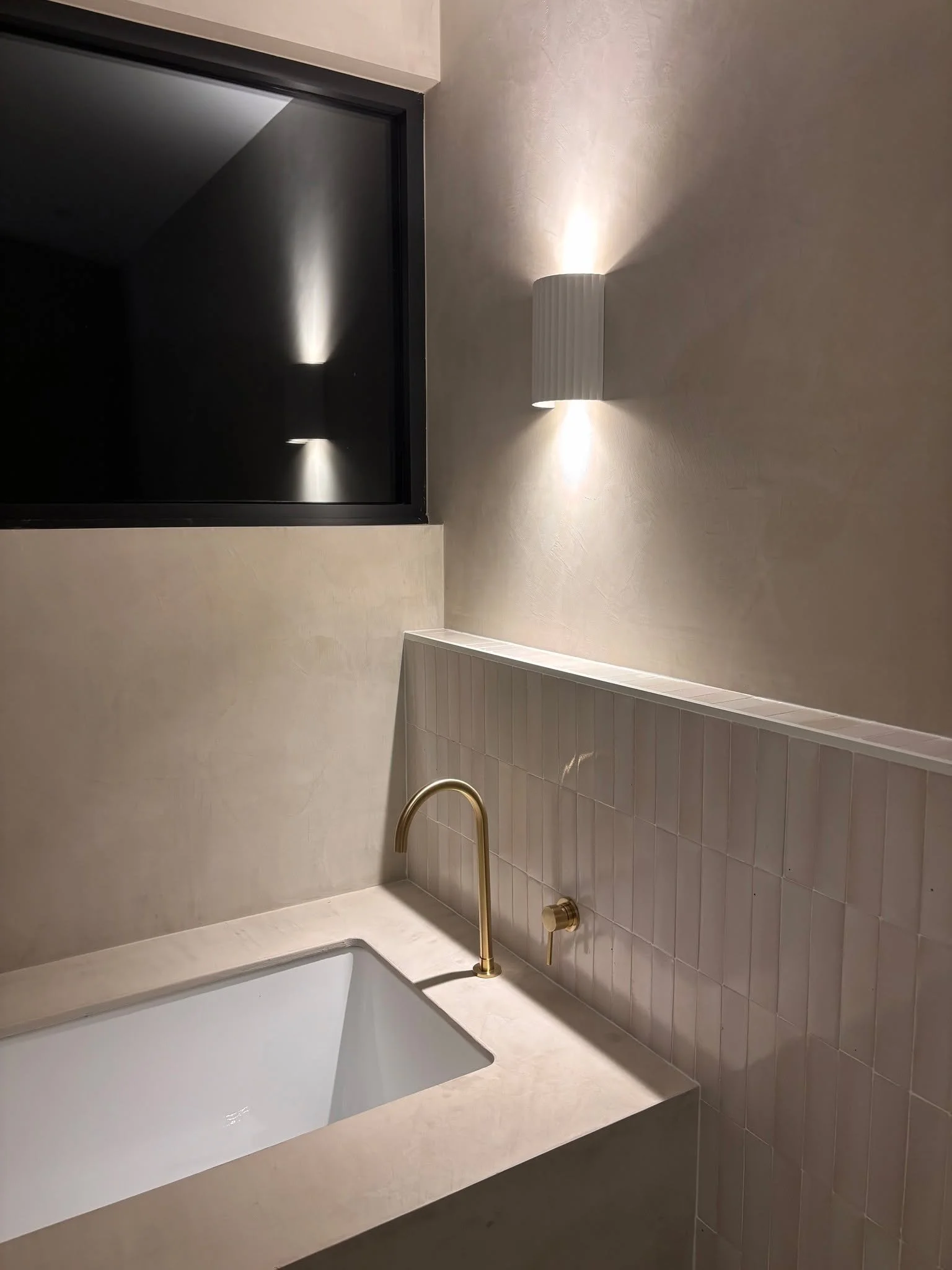 These finishes at night ✨ warm, textured plaster &amp; handmade clay tiles