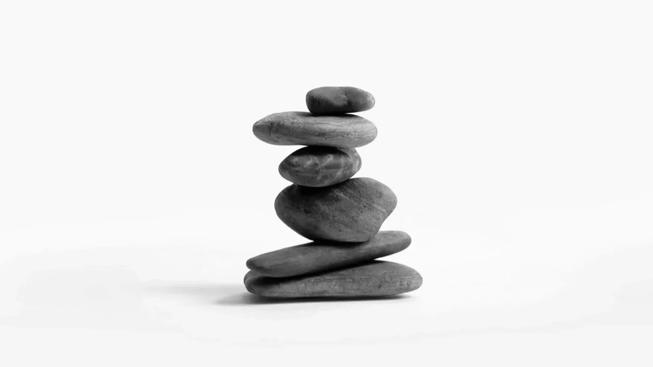 Stack of seven smooth stones one on top of another