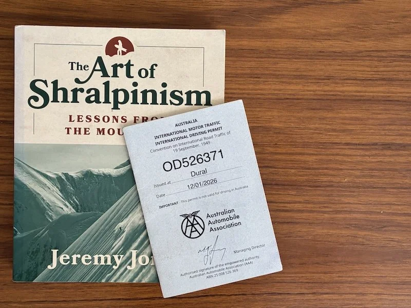 A picture of an IDP with a copy of Jeremy Jones' 'The Art of Shralpinism'
