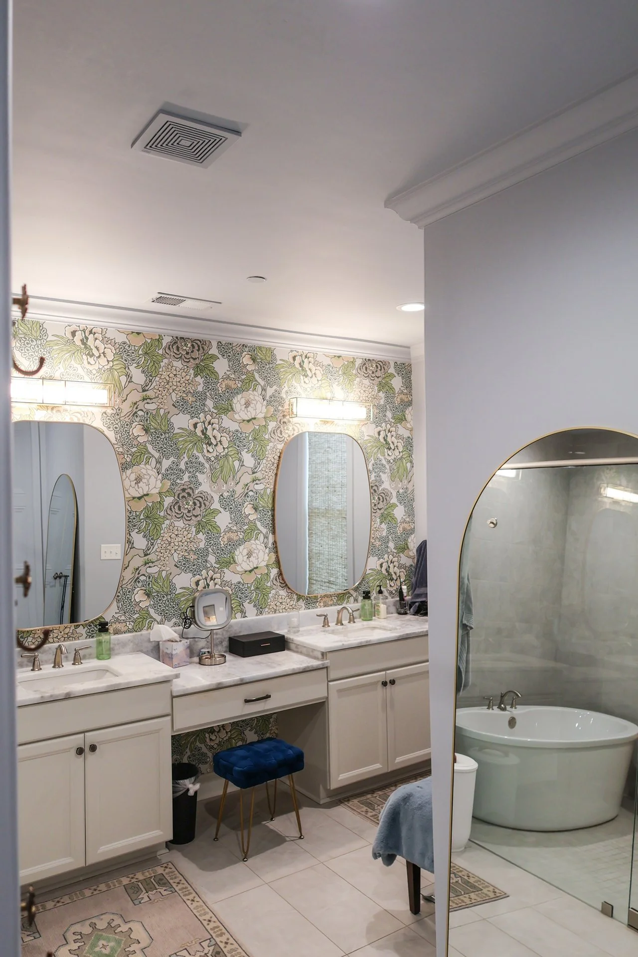 double bathroom with gold accented mirror and custom vanity