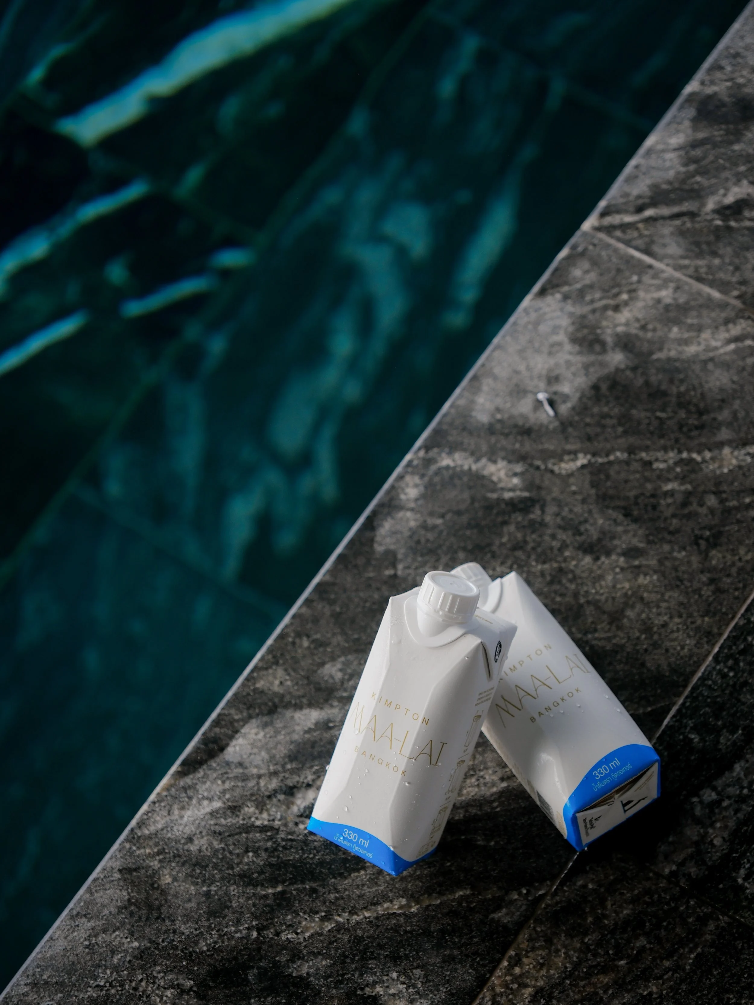 Kimpton Maa Lai Bangkok swimming pool with teal water and pool equipment detail — hotel photography Bangkok 2026