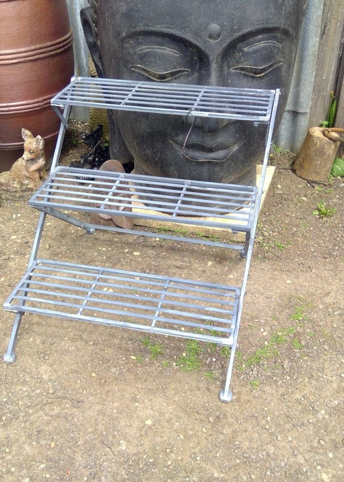 Metal garden three tiered shelves.