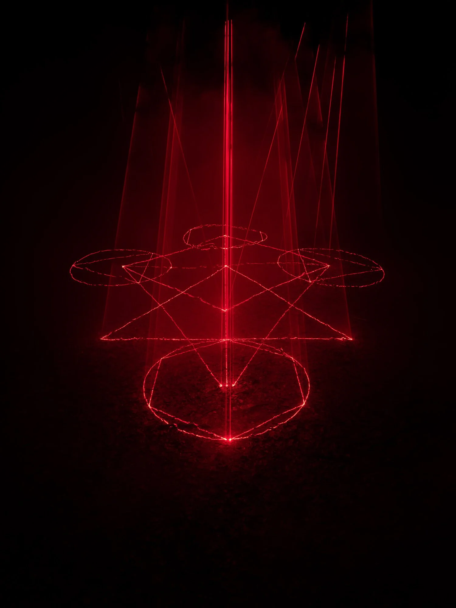 Cathedral of Ego: Light, Code, and Transcendence  MAXIME PLESCIA-BÜSCHI AND BJØRN STAAL  x COLLECTIVE OSLO Red laser light art installation forming geometric shapes and patterns in darkness.