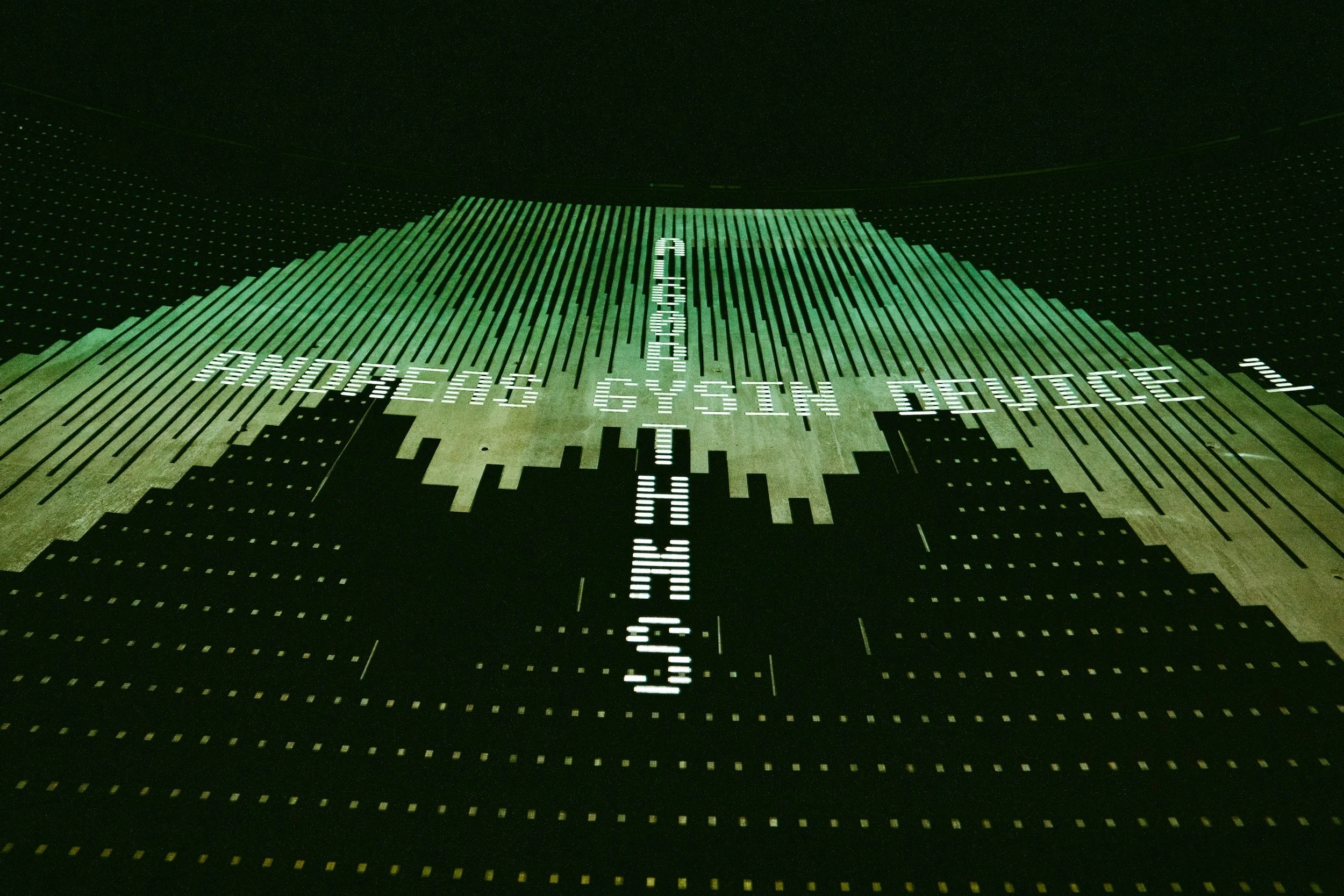 Digital art of city skyline and a monitor with text: 'ANDERSON CYBERSECURITY SYSTEMS.'