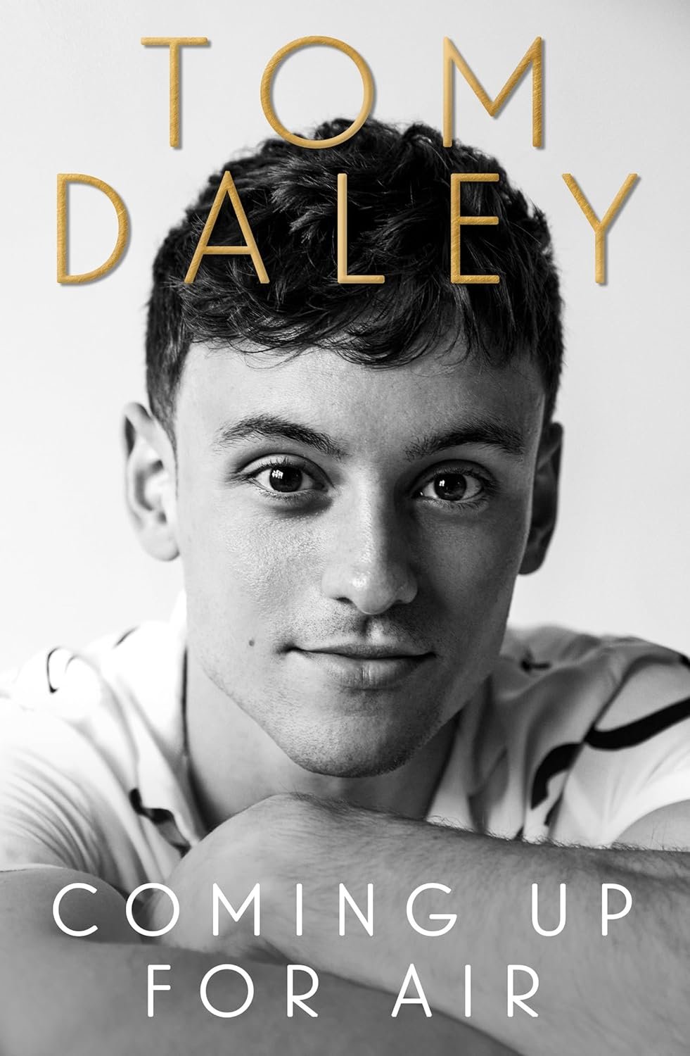 Black and white book cover featuring a person's portrait and the title 'Coming Up for Air' by Tom Daley.