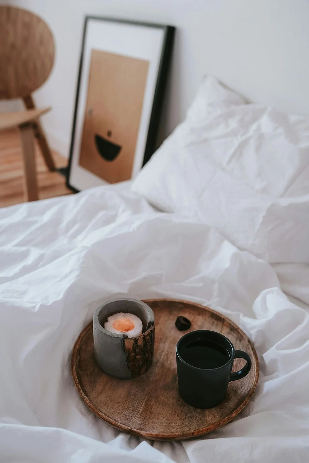 wooden tray holding candle and coffee cup