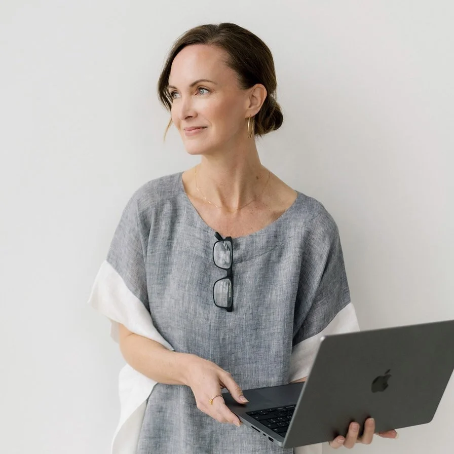 website designer holding laptop