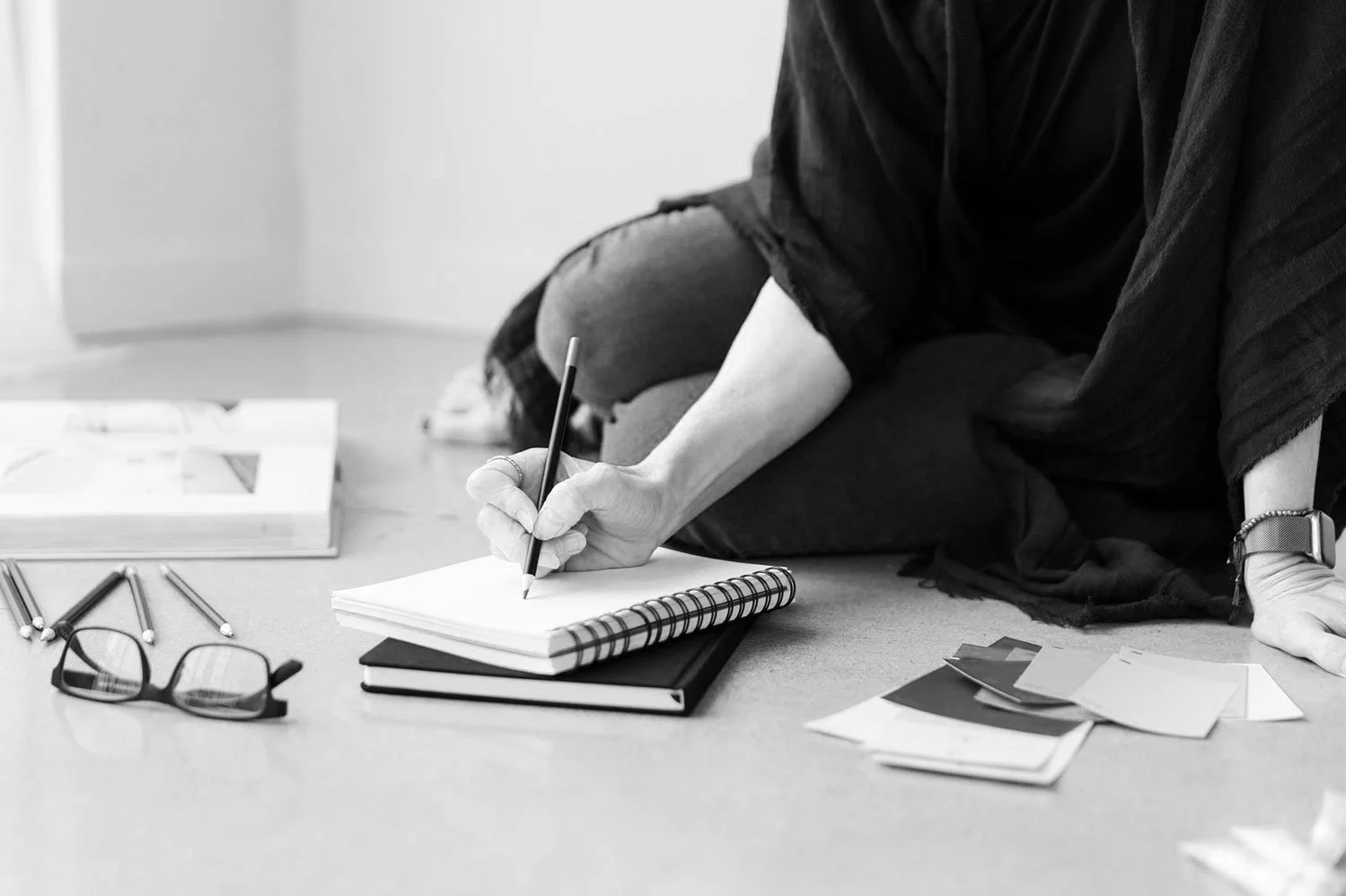 interior designer drawing on notepad