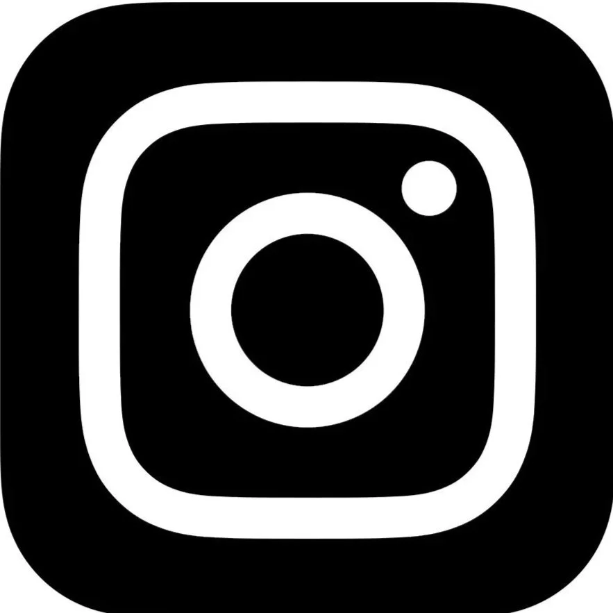 Black and white Instagram logo with a rounded square outline and a camera icon in the center.
