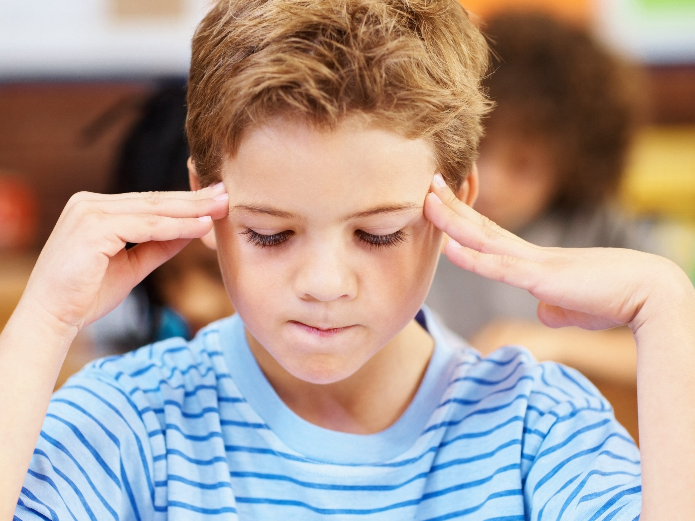 A boy with ADHD trying to concentrate / BlackbirdHealth