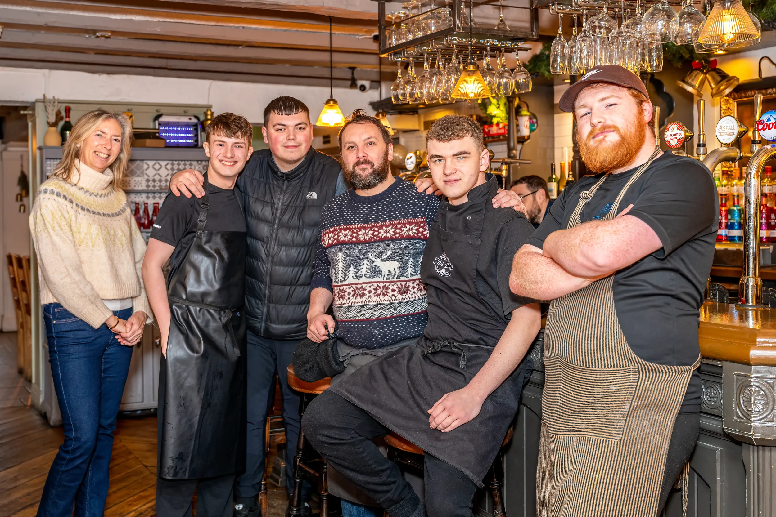 Colour photograph of a team of staff in a country pub