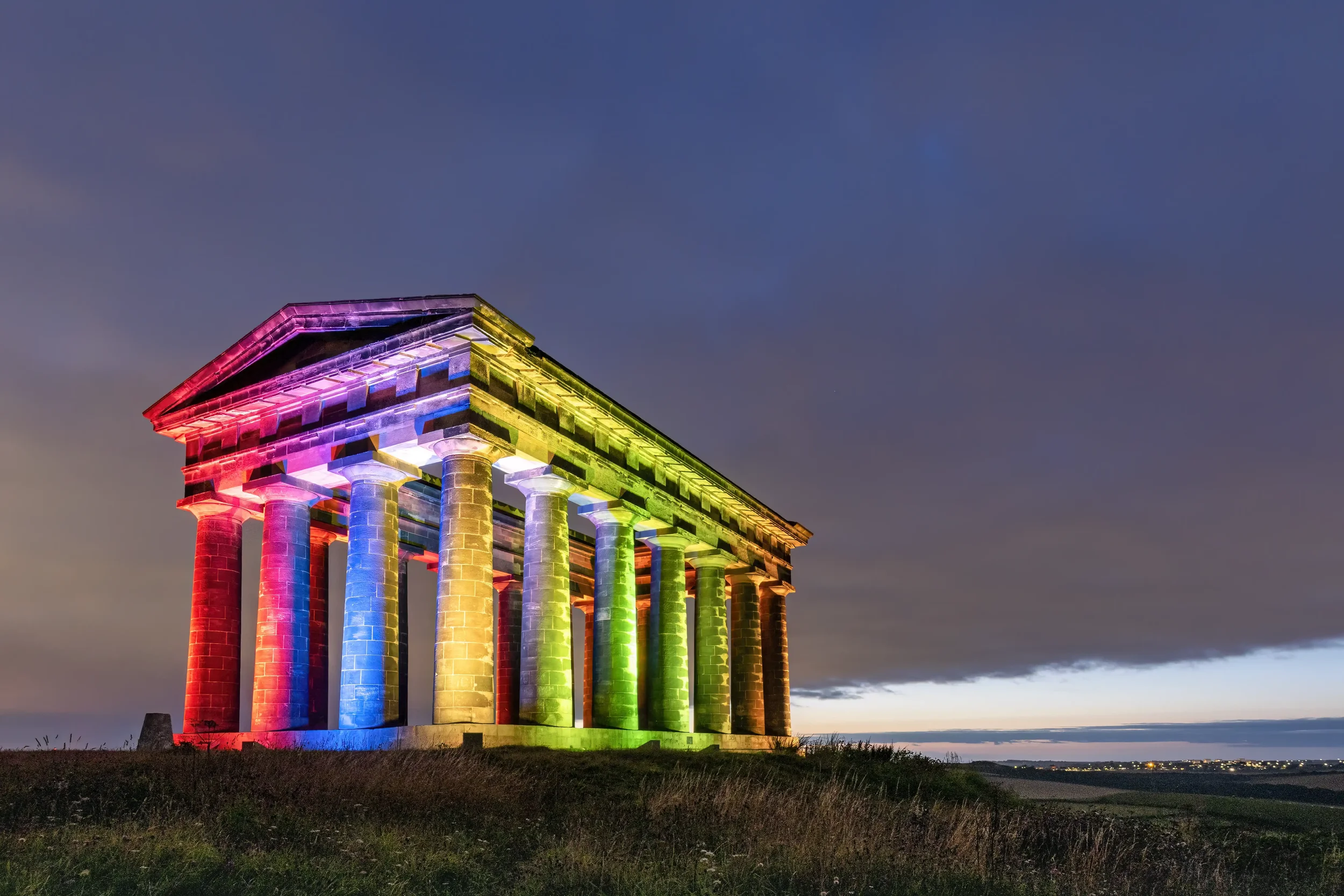 Image of Penshaw Monument, lit up in the colours of the rainbow, in mark of Pride Week, taken shortly before sunrise, 28/8/21.