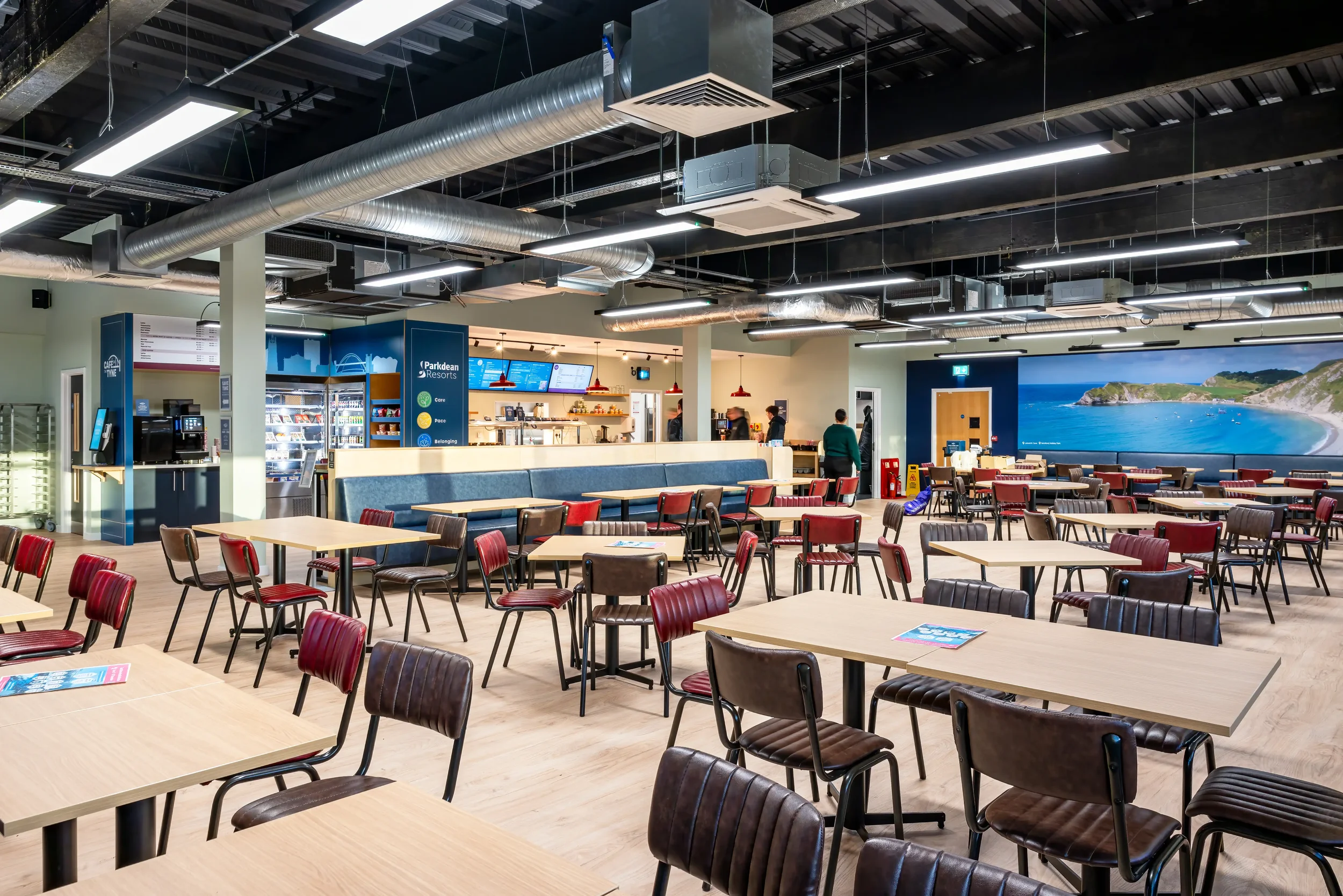 Colour photograph of a large staff cafe in an office block.