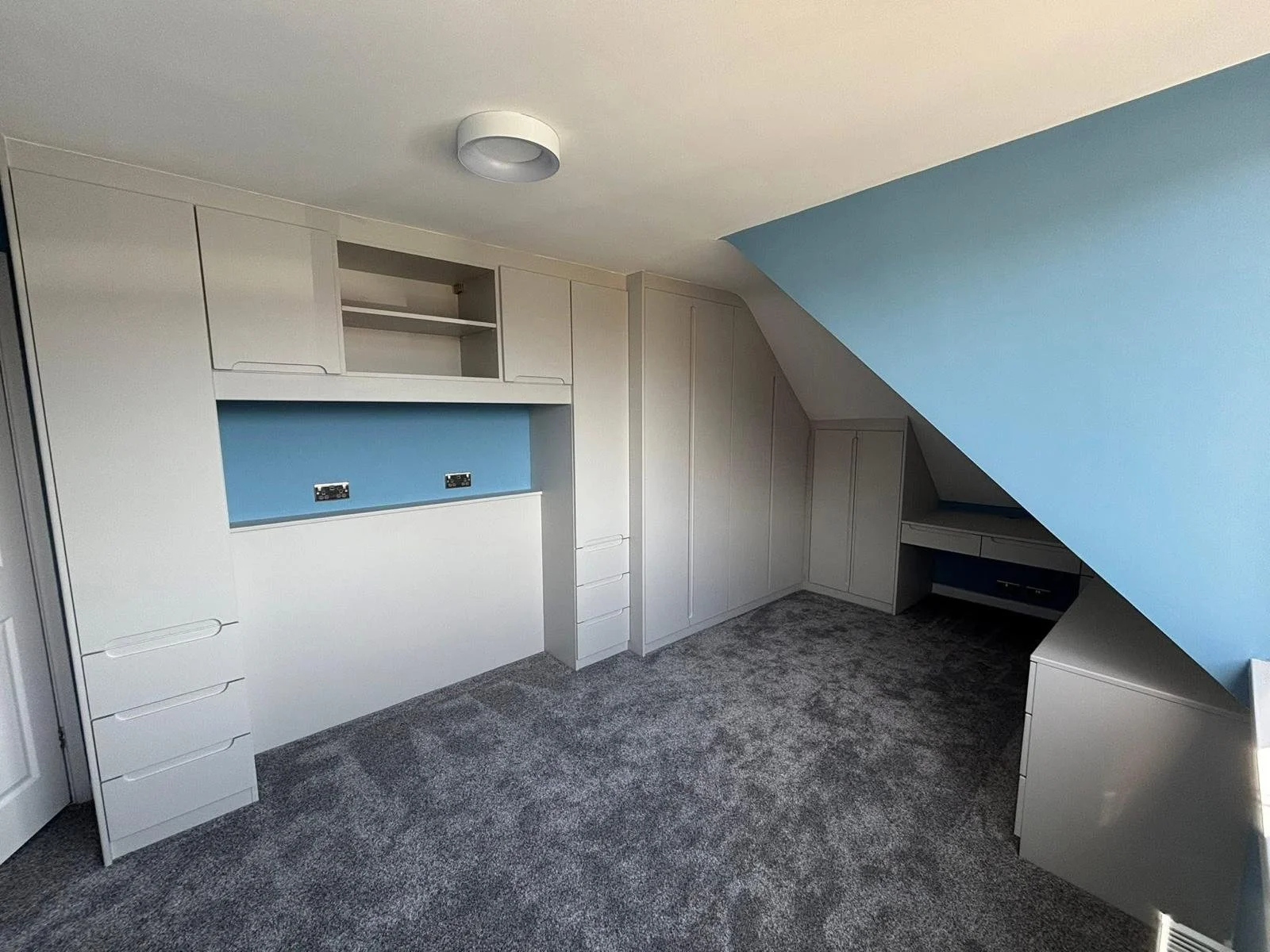 fitted bedroom. attic bedroom. sloping ceiling. bella Chelsea. matt dove grey. angle ceiling. fitted furniture. boys room. snug. desk bedroom. Gosport. Hampshire