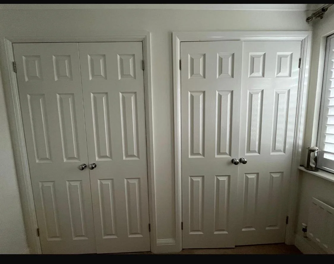 builders wardrobes. wasted storage. rip out hinged doors. remove stud wall. replcement doors. plaster walls. new bella Carrick. sage green. fitted wardrobes. Chichester. West Sussex