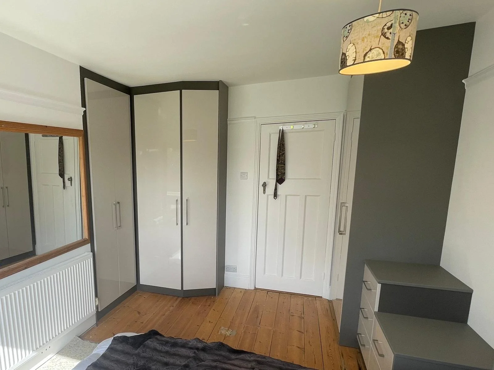fitted wardrobes. fitted bedrooms. bespoke wardrobes. hinged wardrobes. gloss chasmere. taupe. Bella Venice. angle shape walls. Chichester. west Sussex