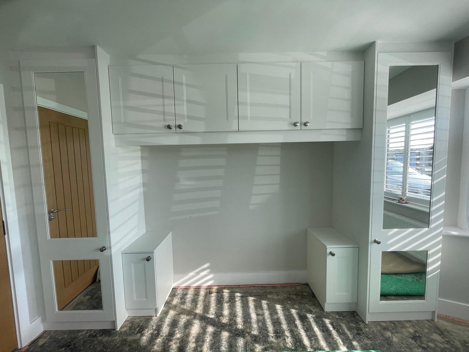 bella Rowan. matt white. mirror doors. fitted bedroom. overhead top cupboards. windsor knobs. Rustington. Littlehampton. West Sussex