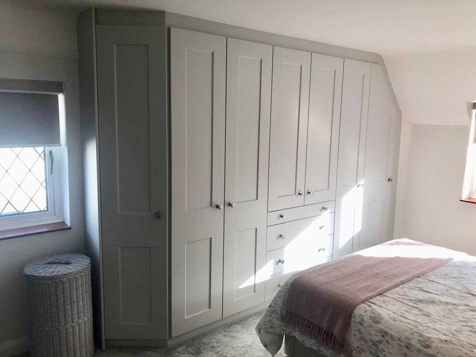 fitted wardrobes. sloping ceiling. angled wardrobes. Bella Cambridge. Dove Grey. East Wittering. West Sussex