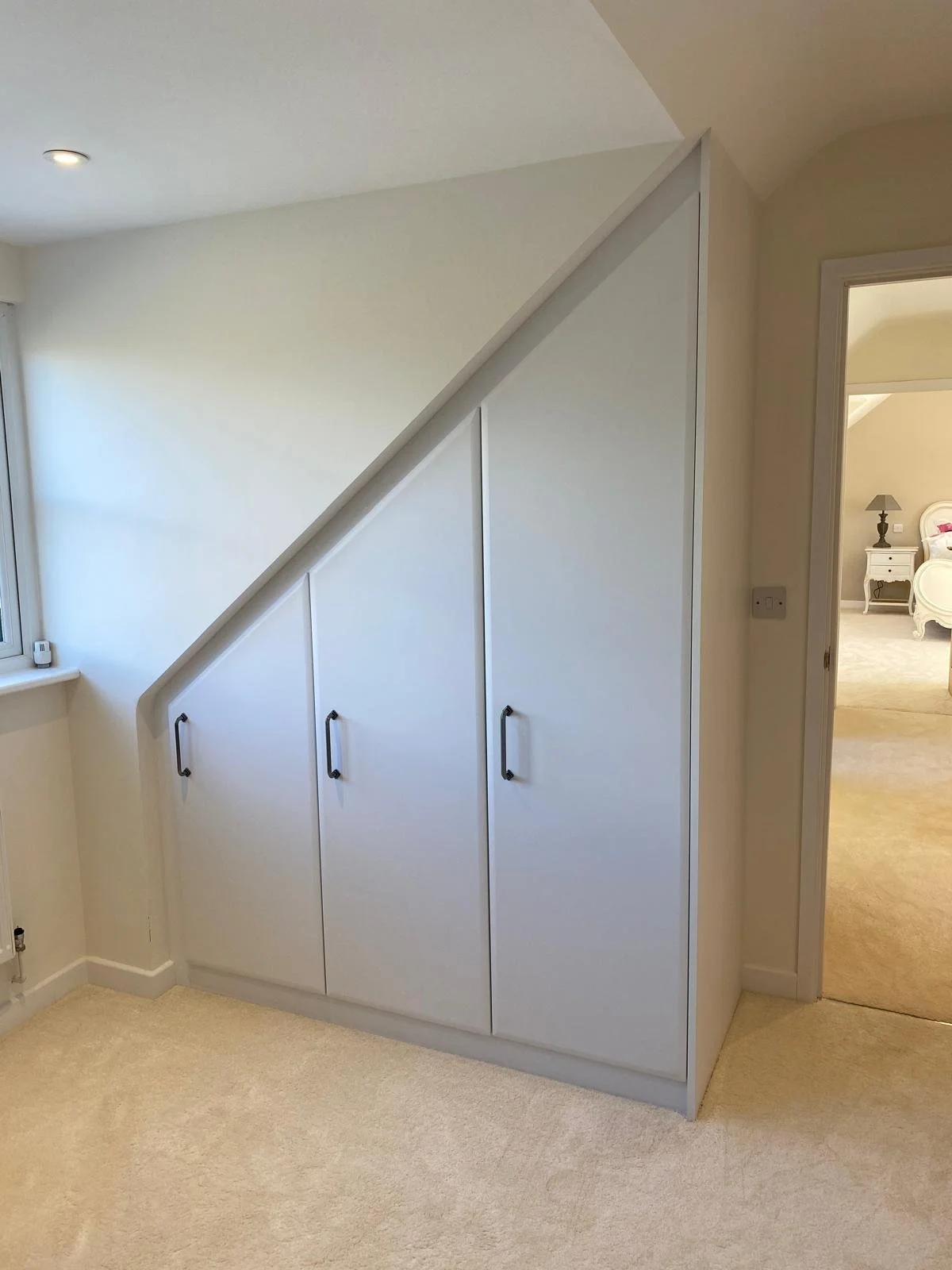 bella sloping. Lincoln. bespoke. fitted wardrobes. angle ceiling. attic bedroom. Barnham. West Sussex
