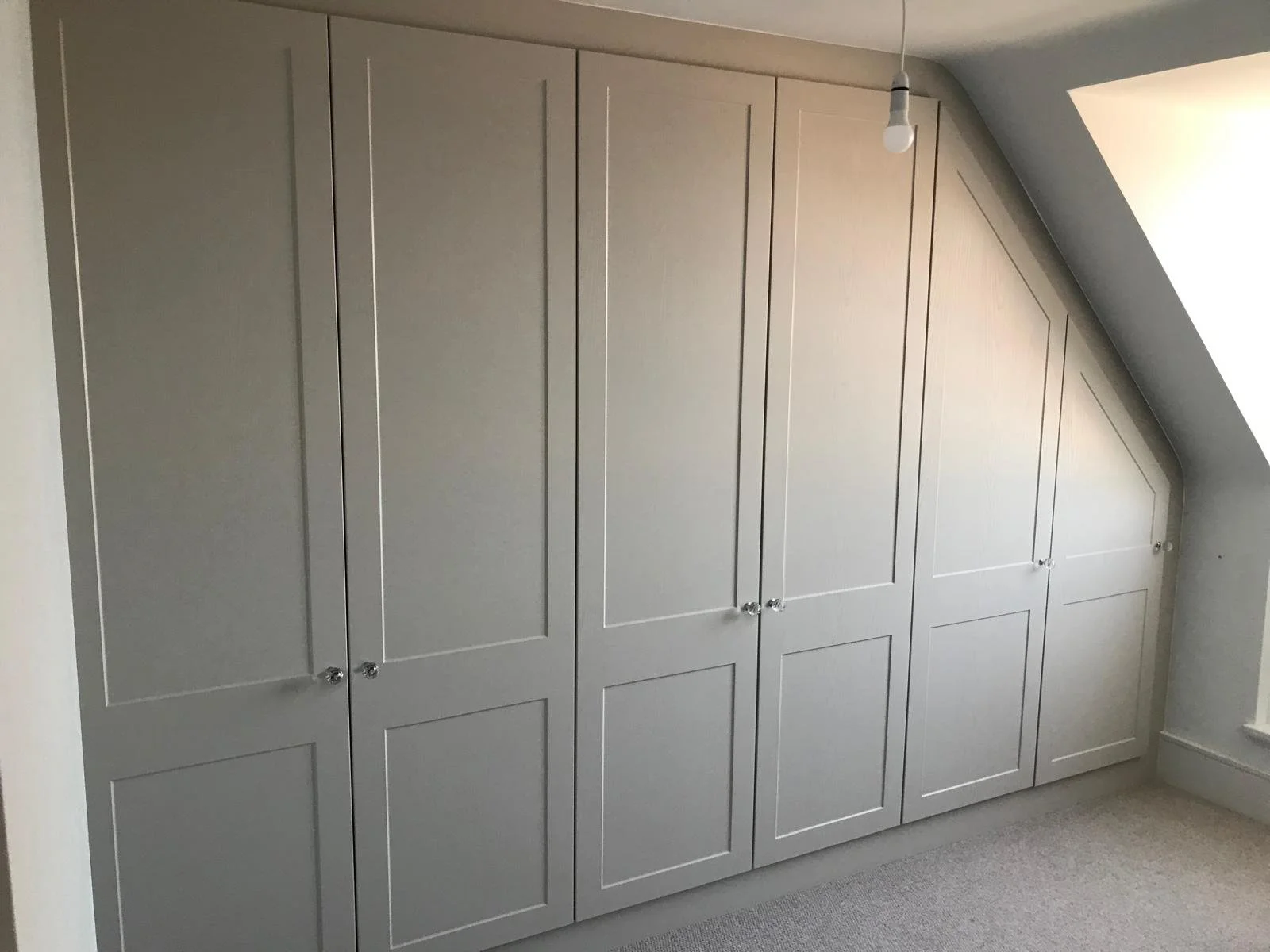 front framed. fitted wardrobes. sloping doors. angle ceiling. made to measure. Midhurst. West Sussex