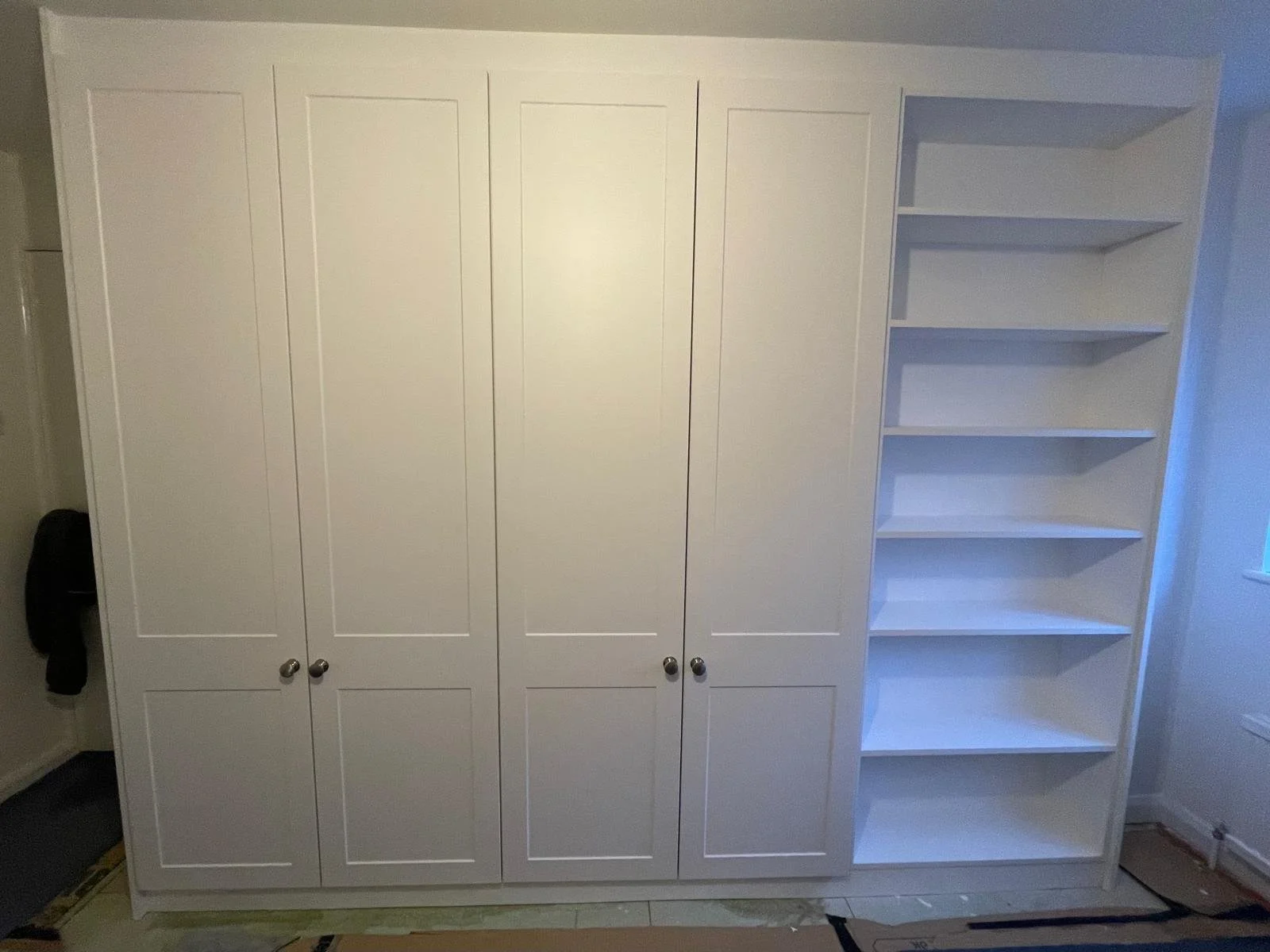 fitted wardrobes. end panel. book shelves. bespoke wardrobes. Bella Richmond. white. Funtington. Chichester