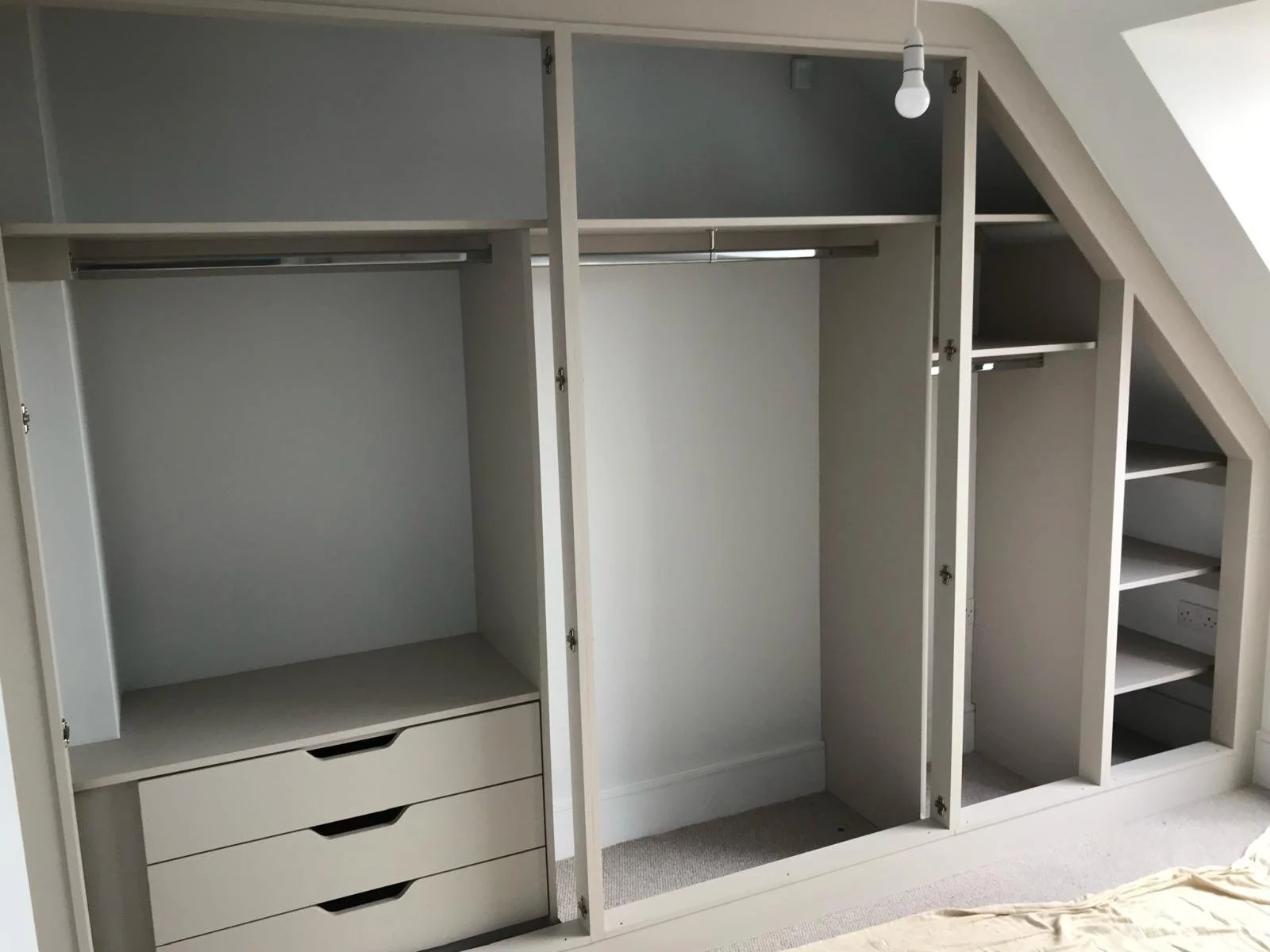 front framed. fitted wardrobes. sloping doors. angle ceiling. made to measure. Midhurst. West Sussex