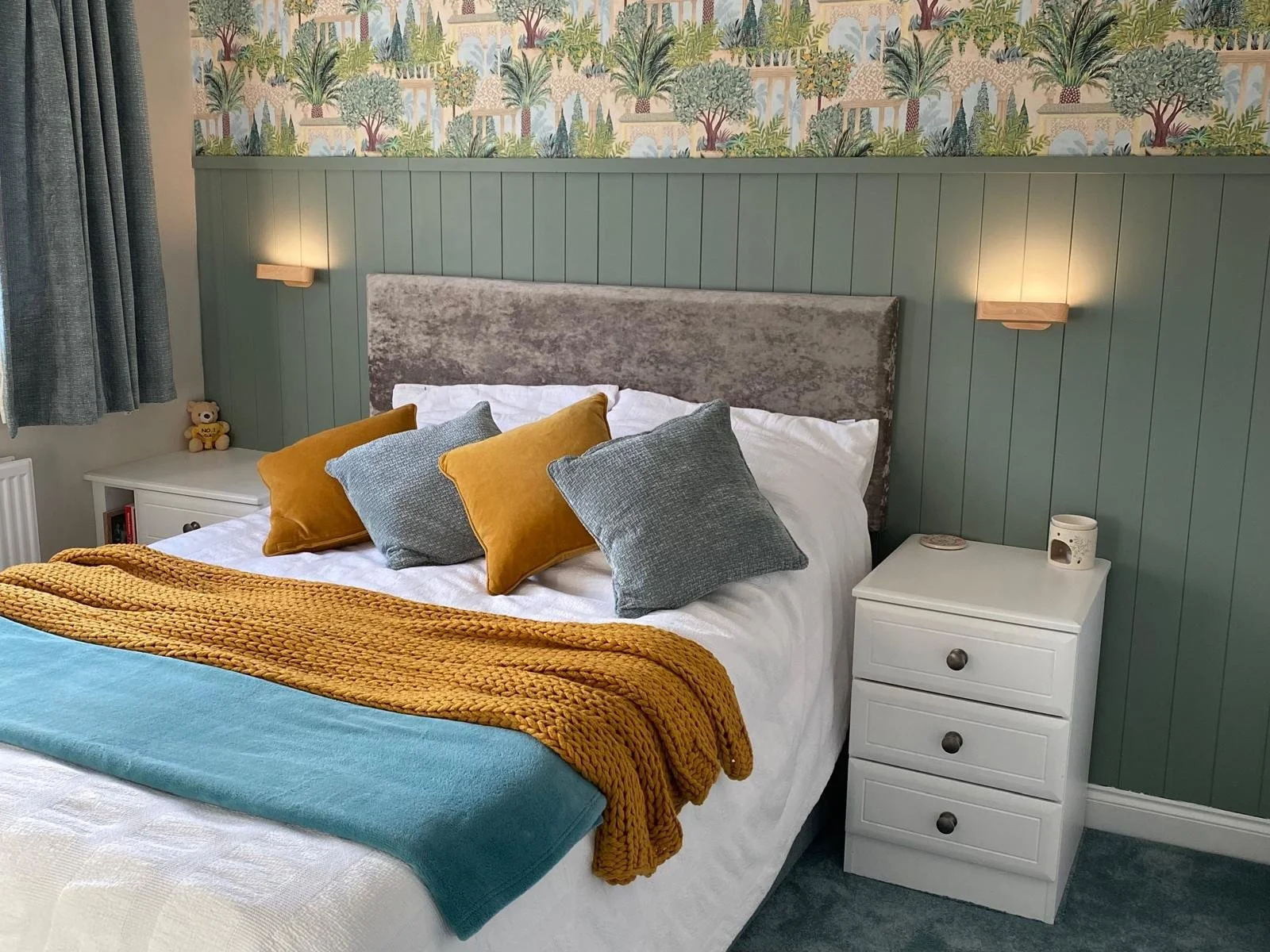 fitted wardrobes. white. palm tree wall paper. golden cushions. sage green wall panelling.bella Euroline. Hill Head. Fareham. Hampshire