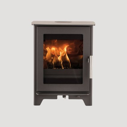 A freestanding wood stove with a glass front showing a burning fire inside.