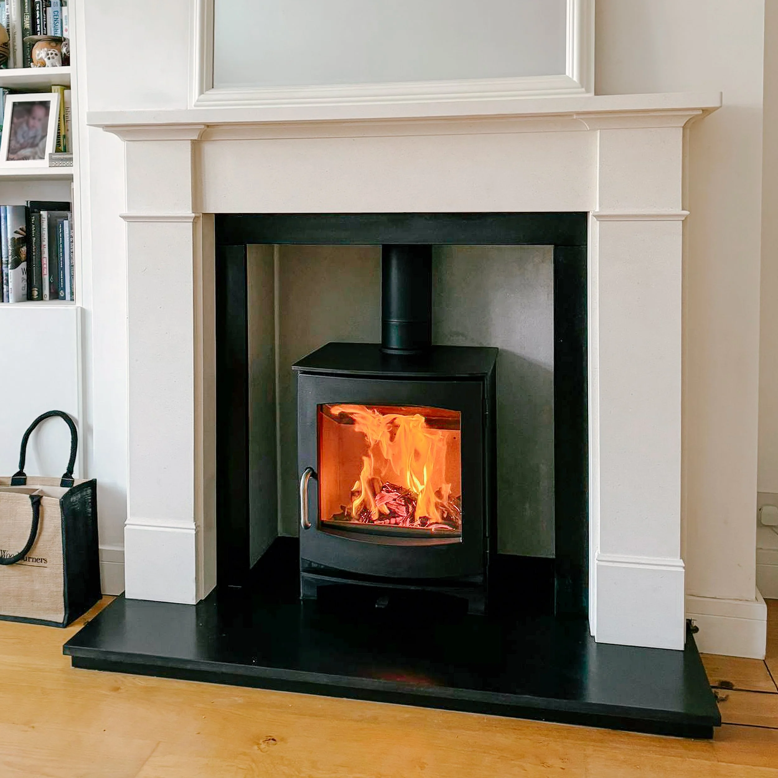 Dik Geurts Ivar 5 Wood Burning Stove with Limestone Mantel and Granite Hearth.