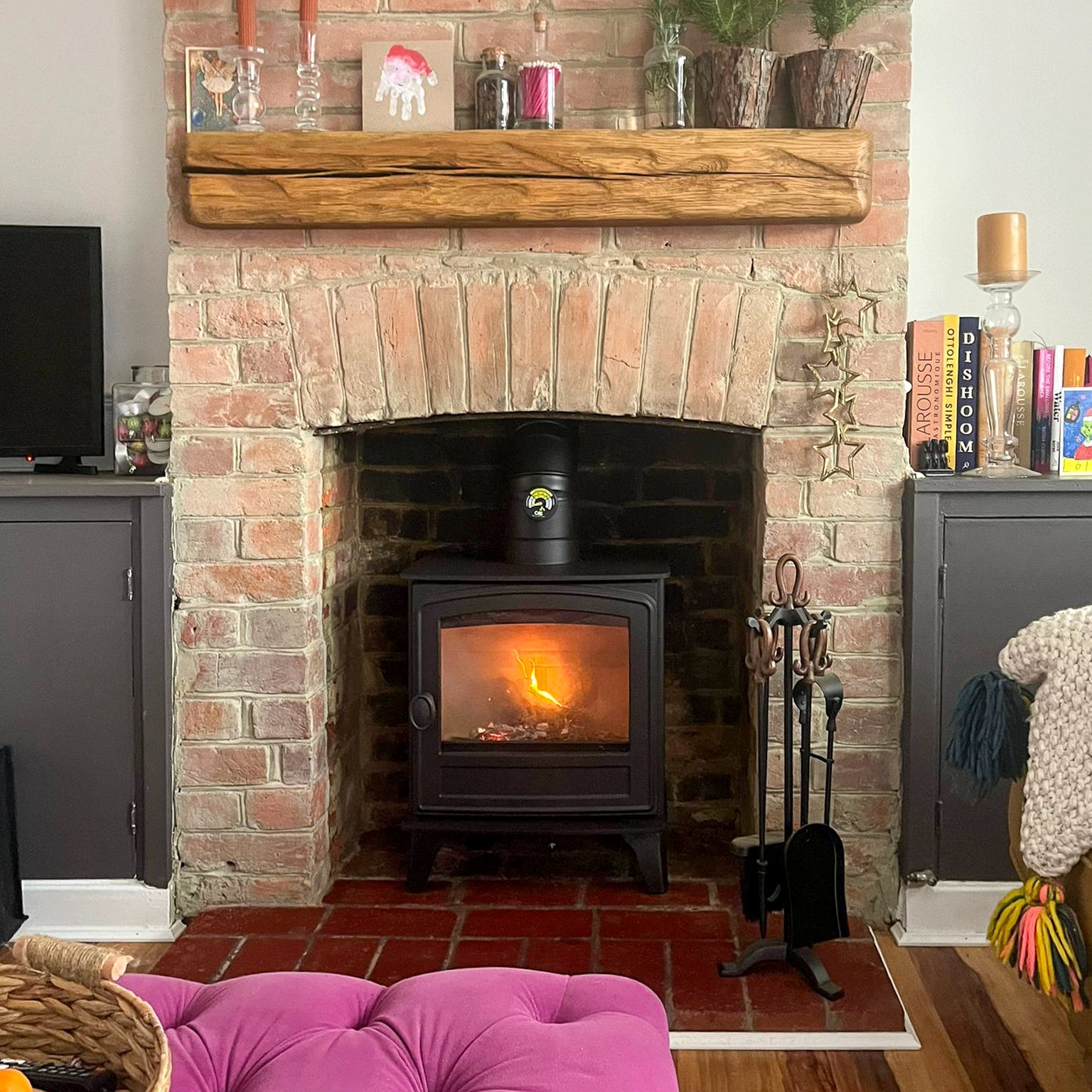 Hunter Herald 4 Eco Installed in Brick Chimney with Tiled Hearth and Floating Oak Beam.