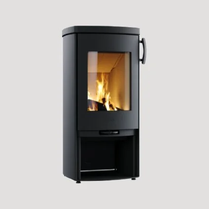 Black wood stove with glass door showing fire inside.
