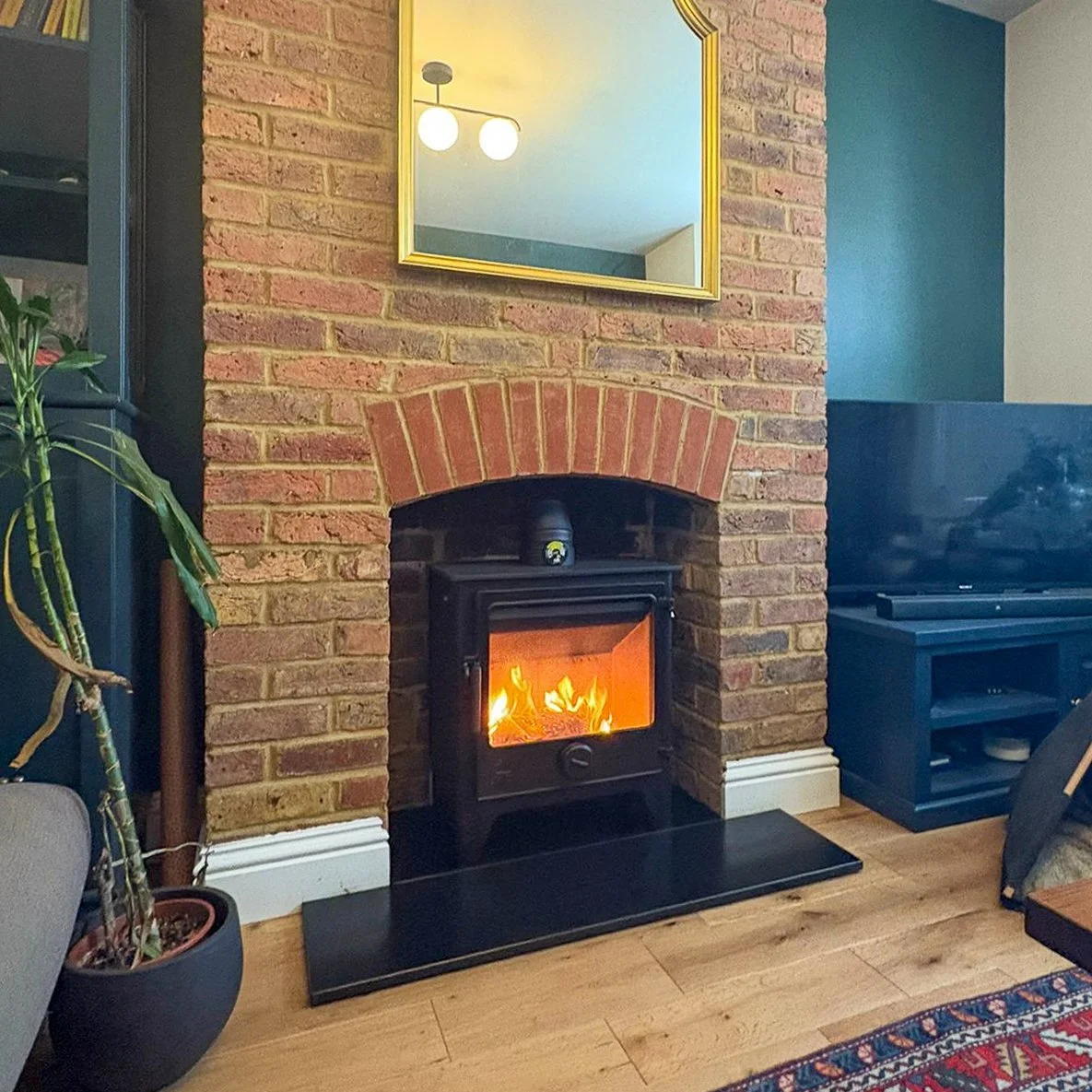 Deanforge Dartmoor W5 Wood Burning Stove in Brick Chimney with Granite Hearth