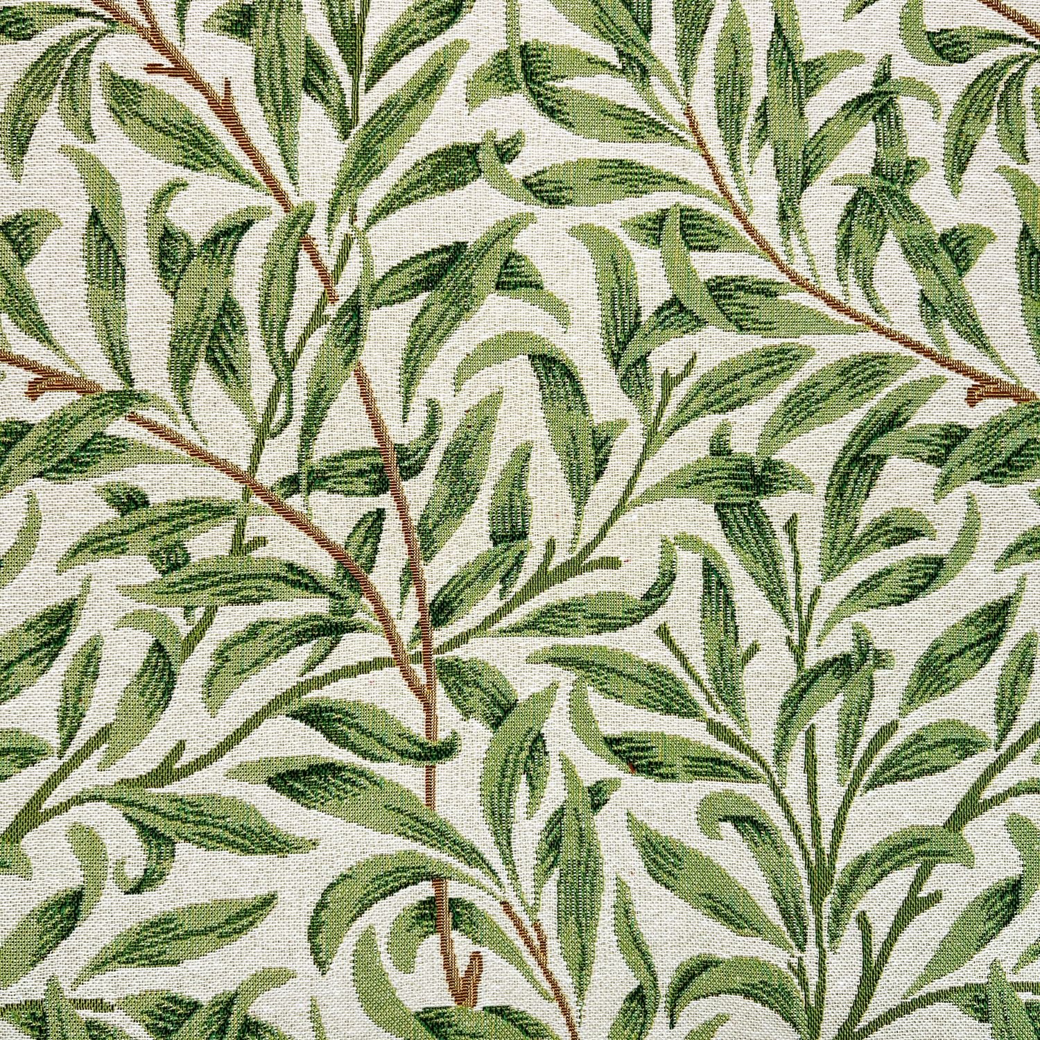 Close-up of a fabric with a green leafy pattern on a white background.