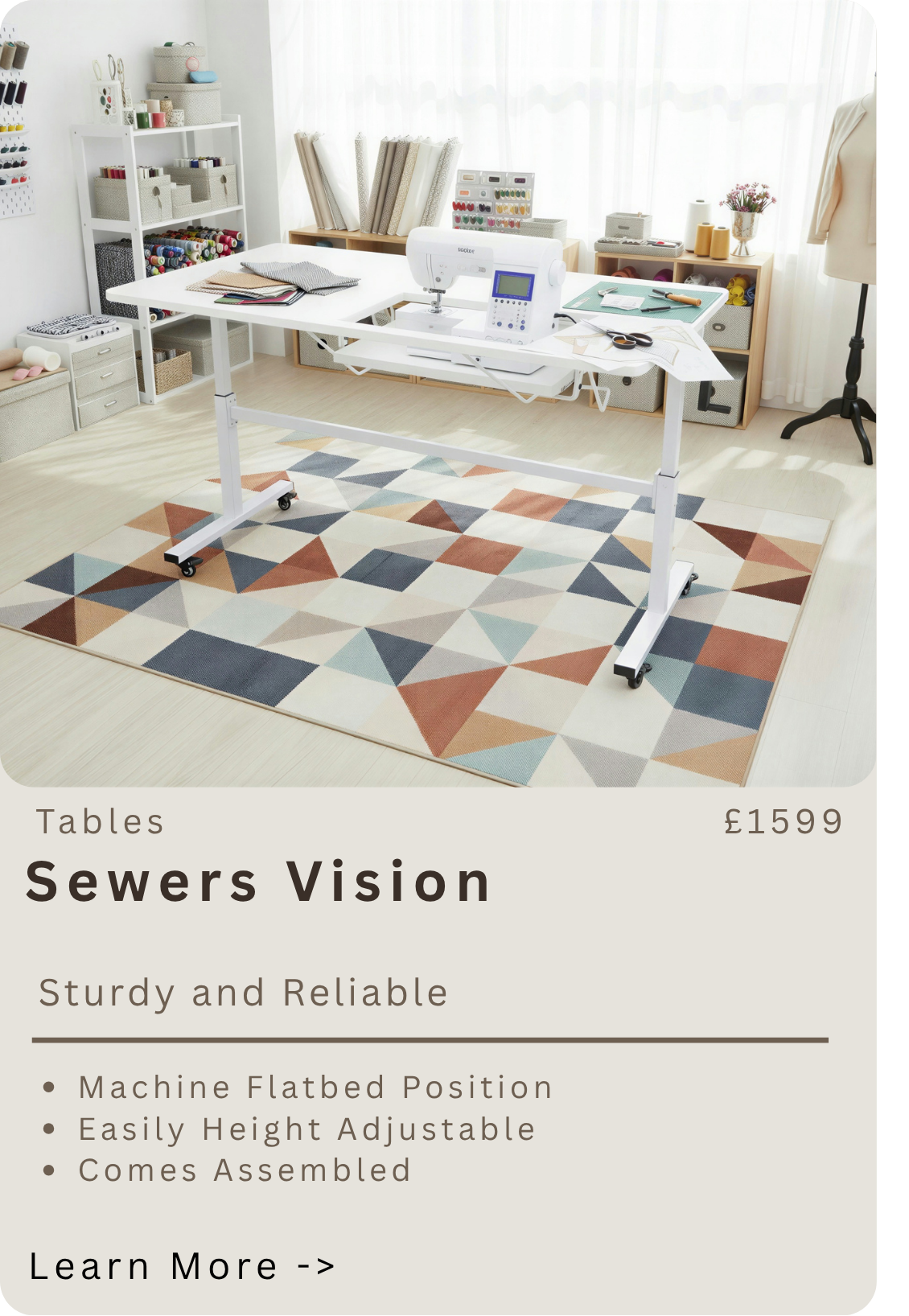 A sewing machine on a white adjustable table in a well-lit room with shelves containing fabric, thread, and sewing supplies. The room has a colorful geometric patterned rug on light wood flooring.