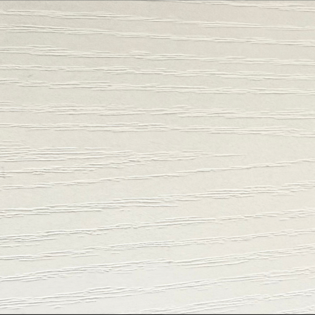 Close-up of a textured white wall with horizontal lines.