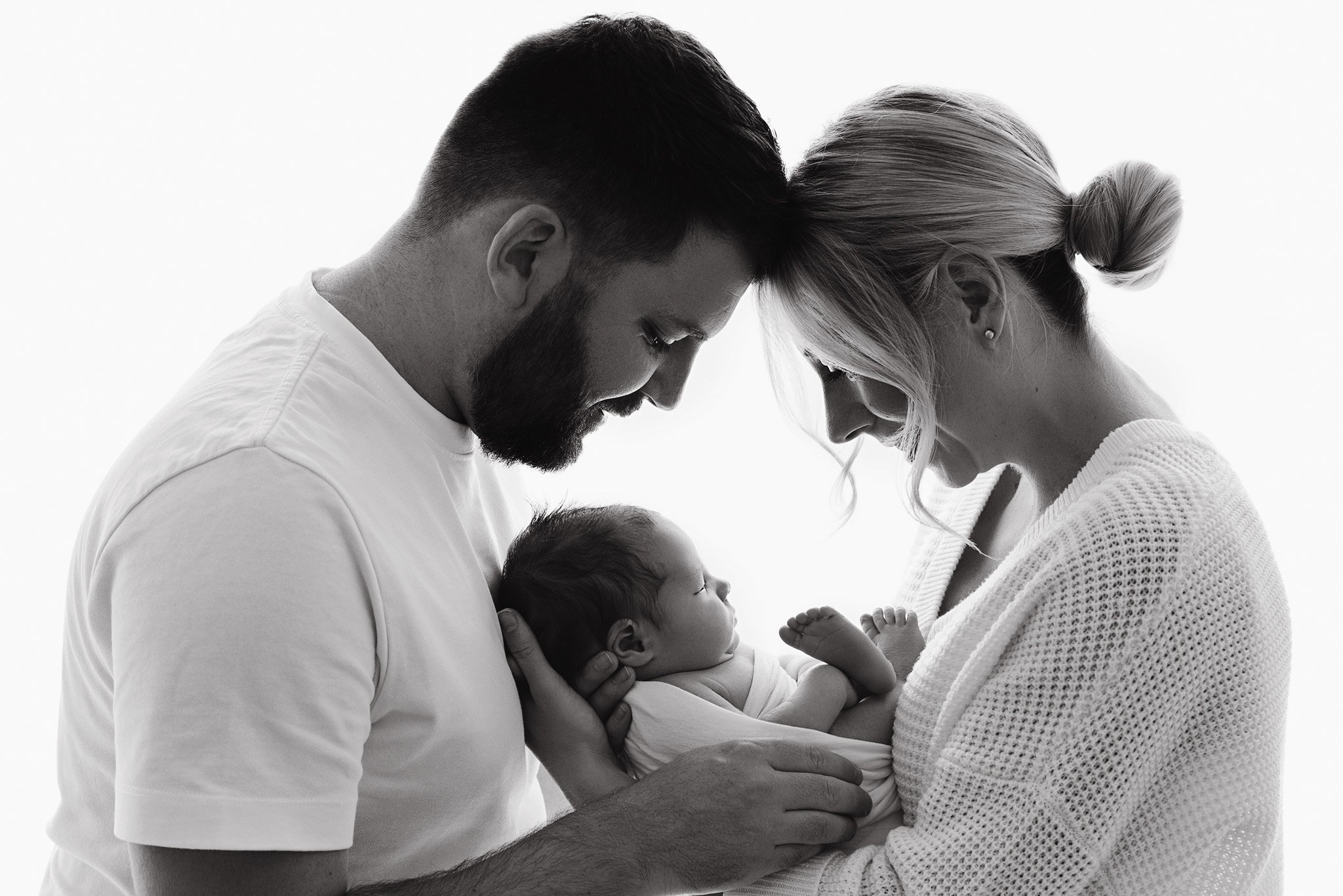 Gentle, baby-led newborn photography in Newmarket, Suffolk. Calm home studio sessions focused on connection and timeless imagery.